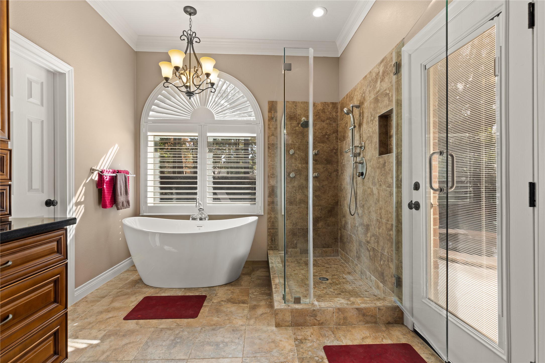 Primary bathroom with soaking tub, separate shower, with direct access to the pool/spa area