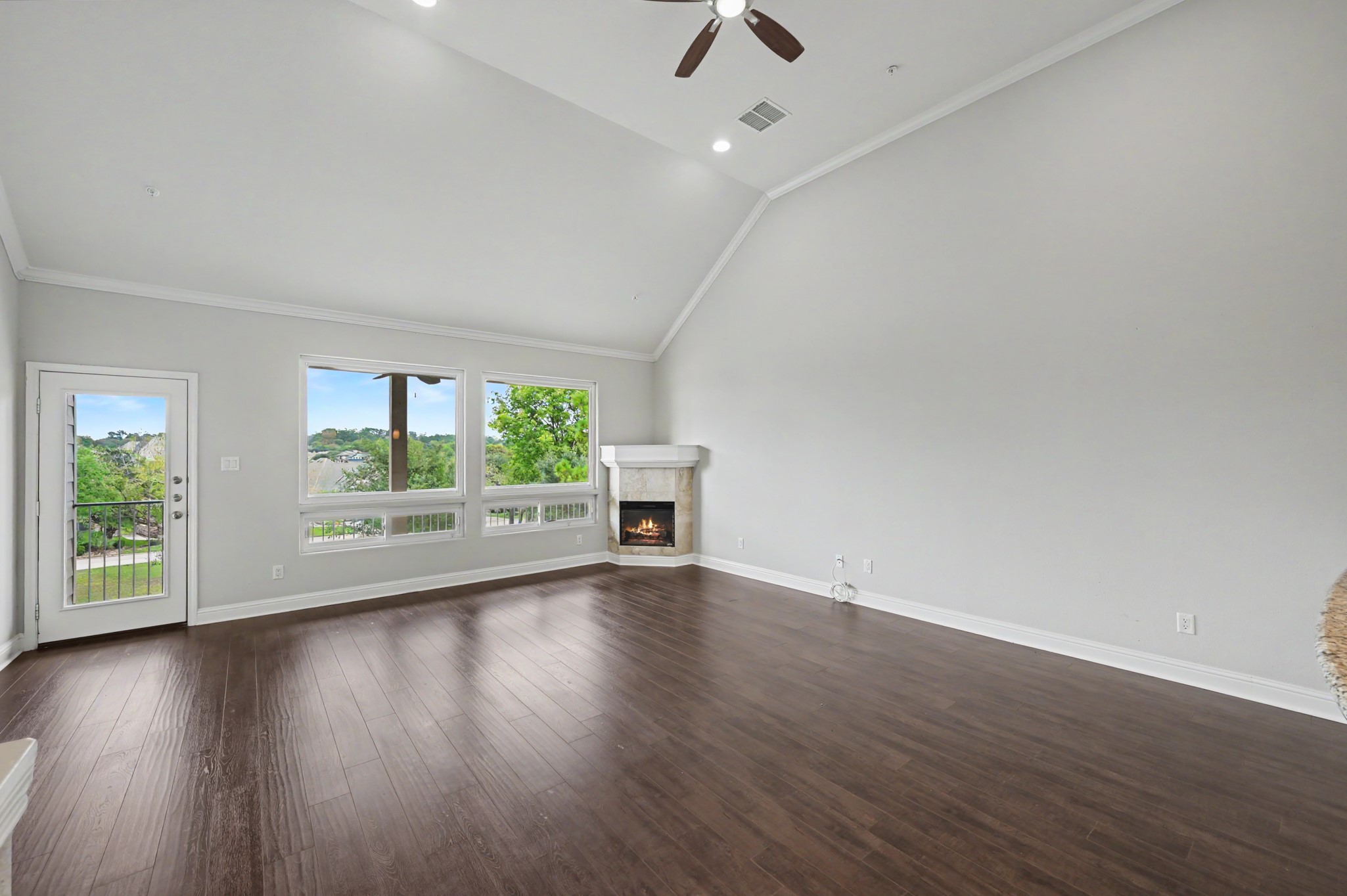 2nd floor living room and electric fireplace and balcony
