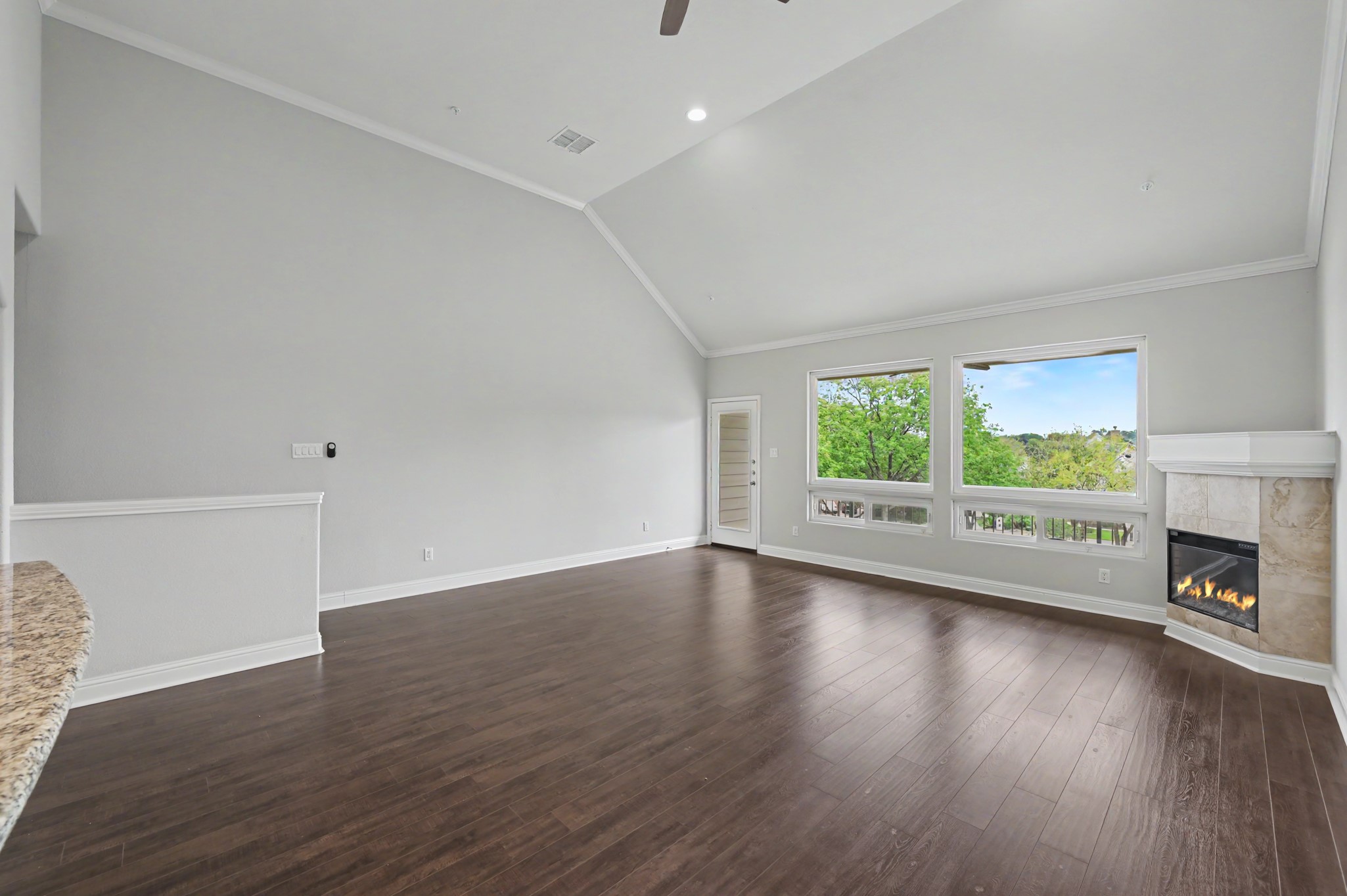 2nd floor living room and electric fireplace and balcony