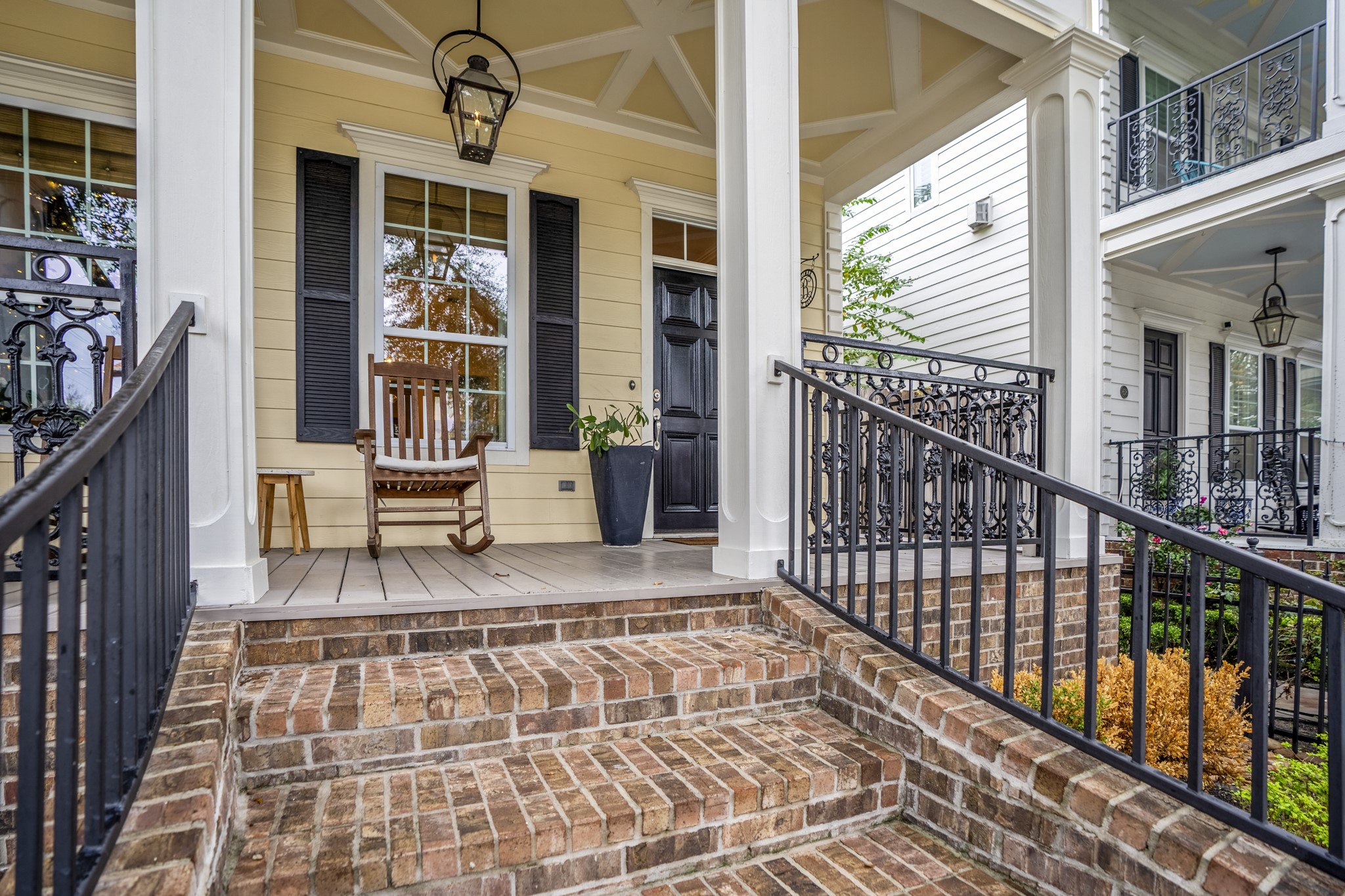 Brick stairs welcome you up to the covered entry of this home. The front door is west-facing. Brick stairs welcome you up to the covered entry of this home. The front door is west-facing.