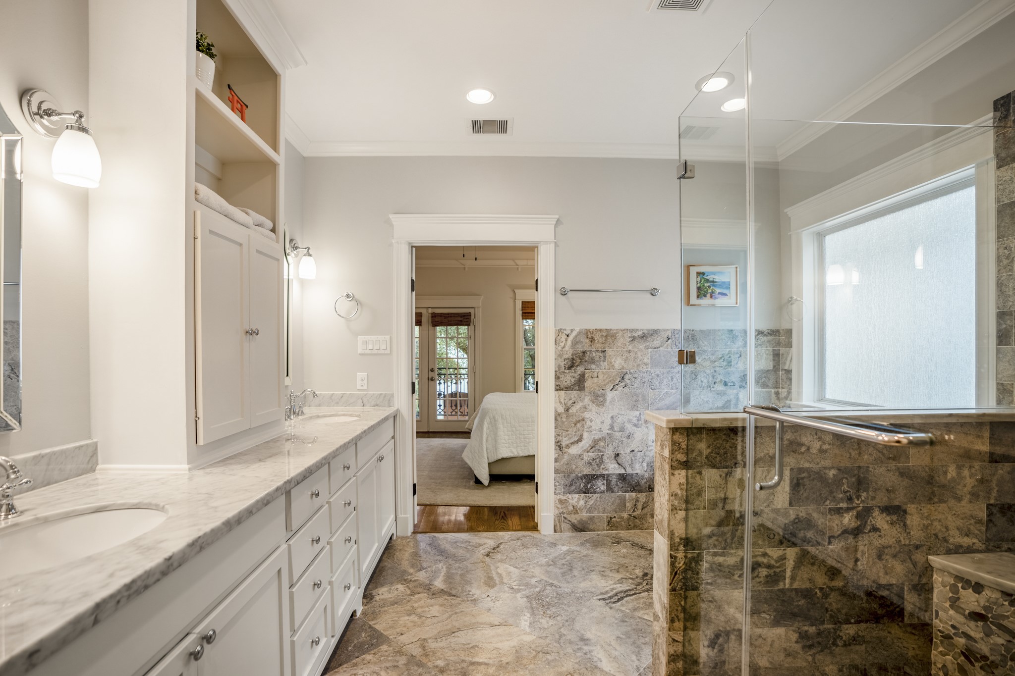 Welcome inside this primary bathroom with a separate soaking tub and stand-up shower.