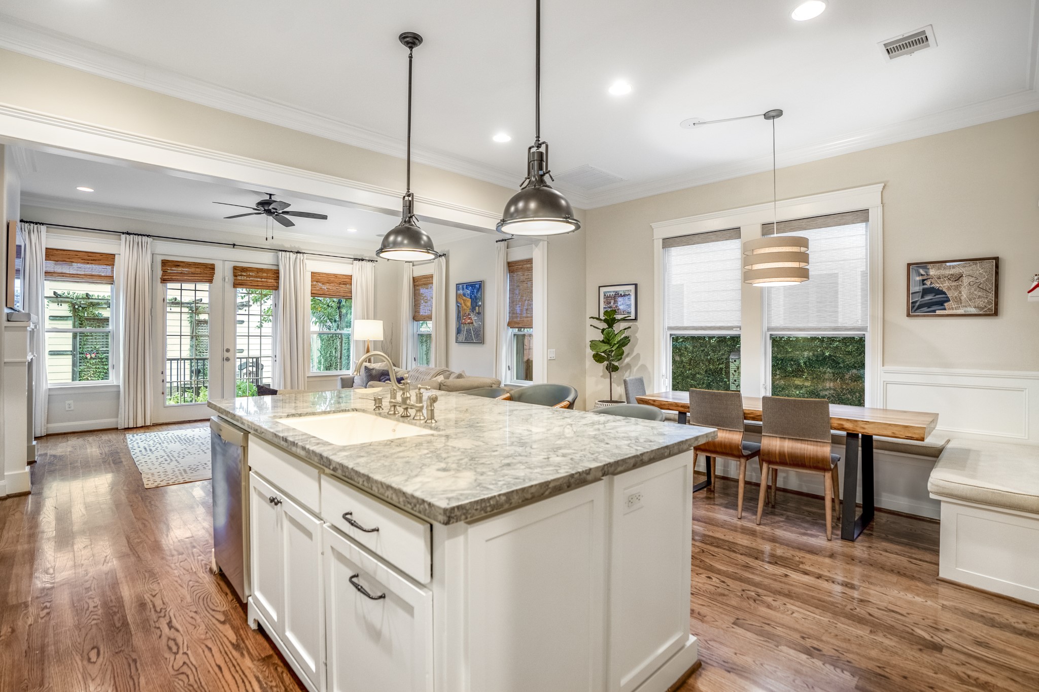 Another view of this kitchen in relation to the dining area and the family room in the back of the home.