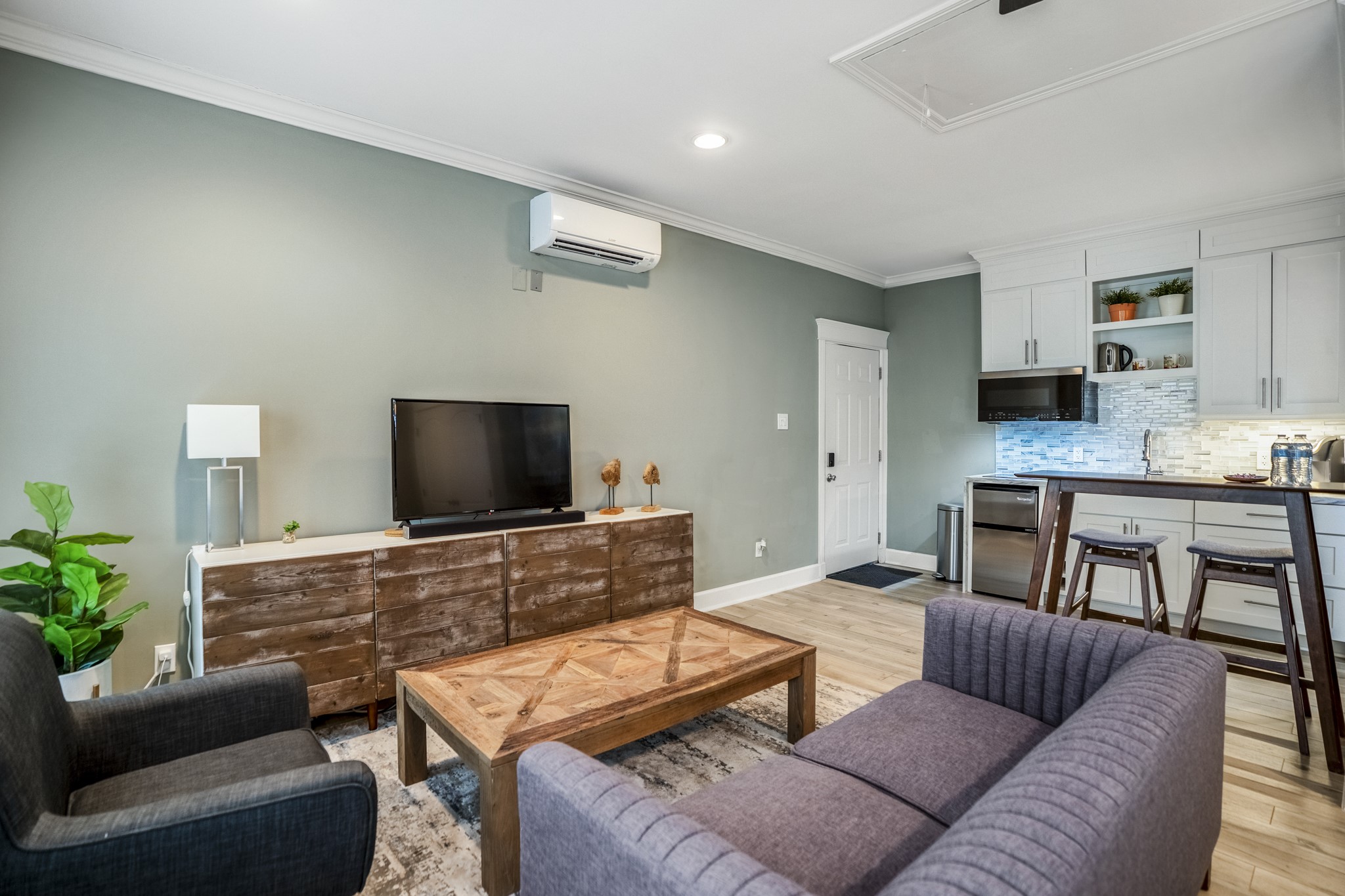 Welcome inside this finished garage apartment with a full living room and kitchenette.