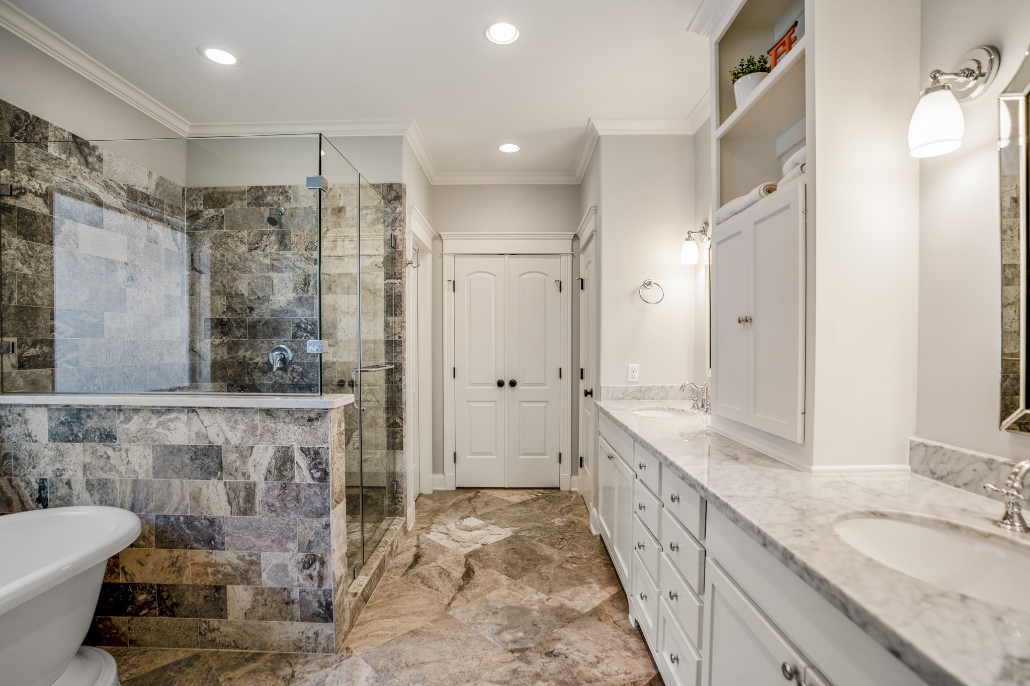 Door straight ahead is the large walk-in closet. Closed door to the right is the water closet.