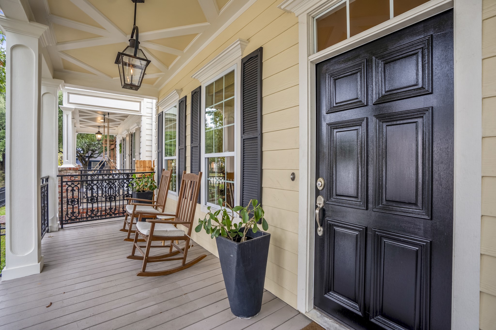 The first-floor covered balcony is spacious enough for rocking chairs, or an entire outdoor couch and side tables. Imagine having your morning coffee here every day enjoying this quiet and peaceful street. The first-floor covered balcony is spacious enough for rocking chairs, or an entire outdoor couch and side tables. Imagine having your morning coffee here every day enjoying this quiet and peaceful street.