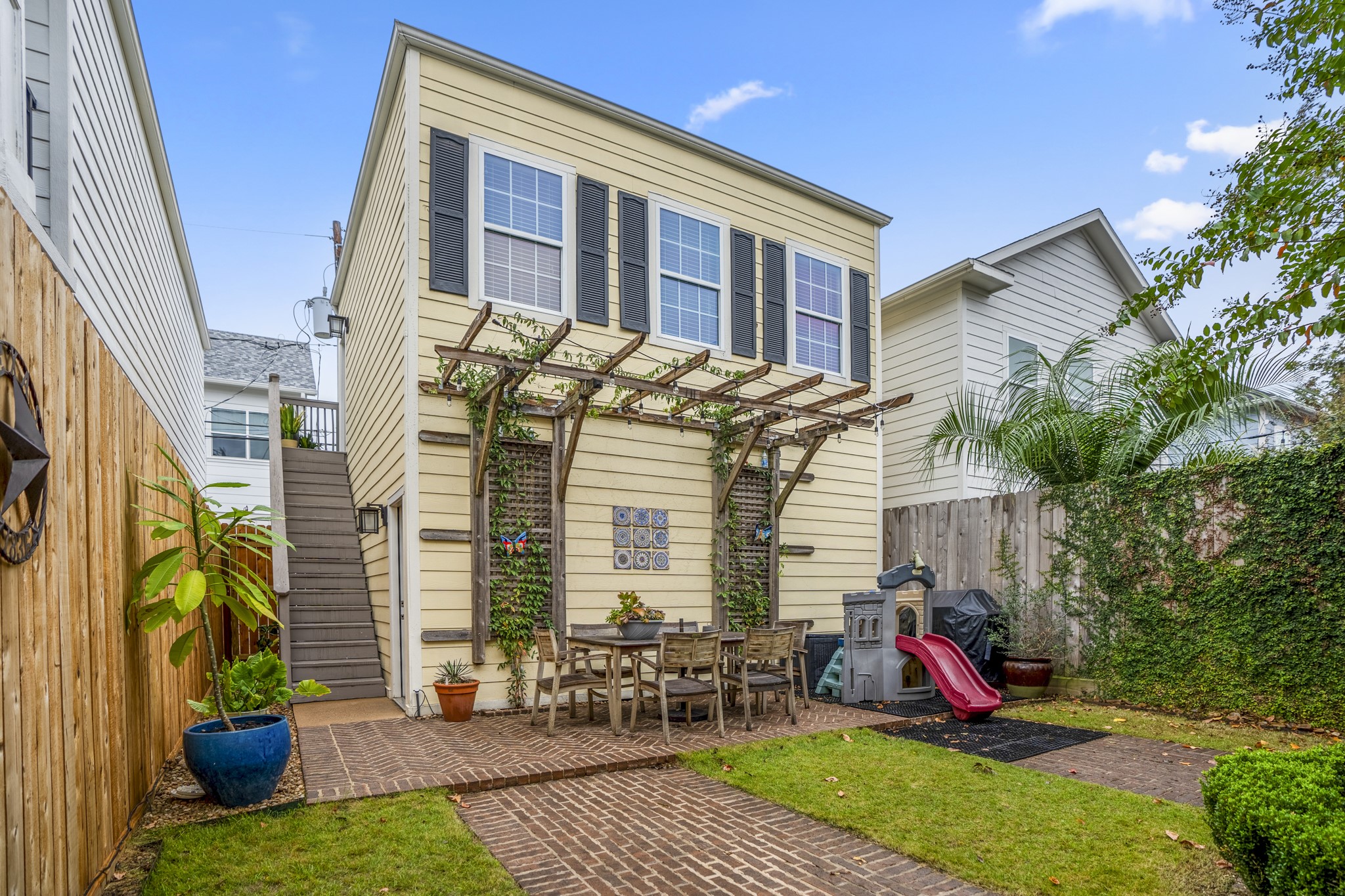 This is the view of your garage apartment from the backyard. Let's take you upstairs and inside.