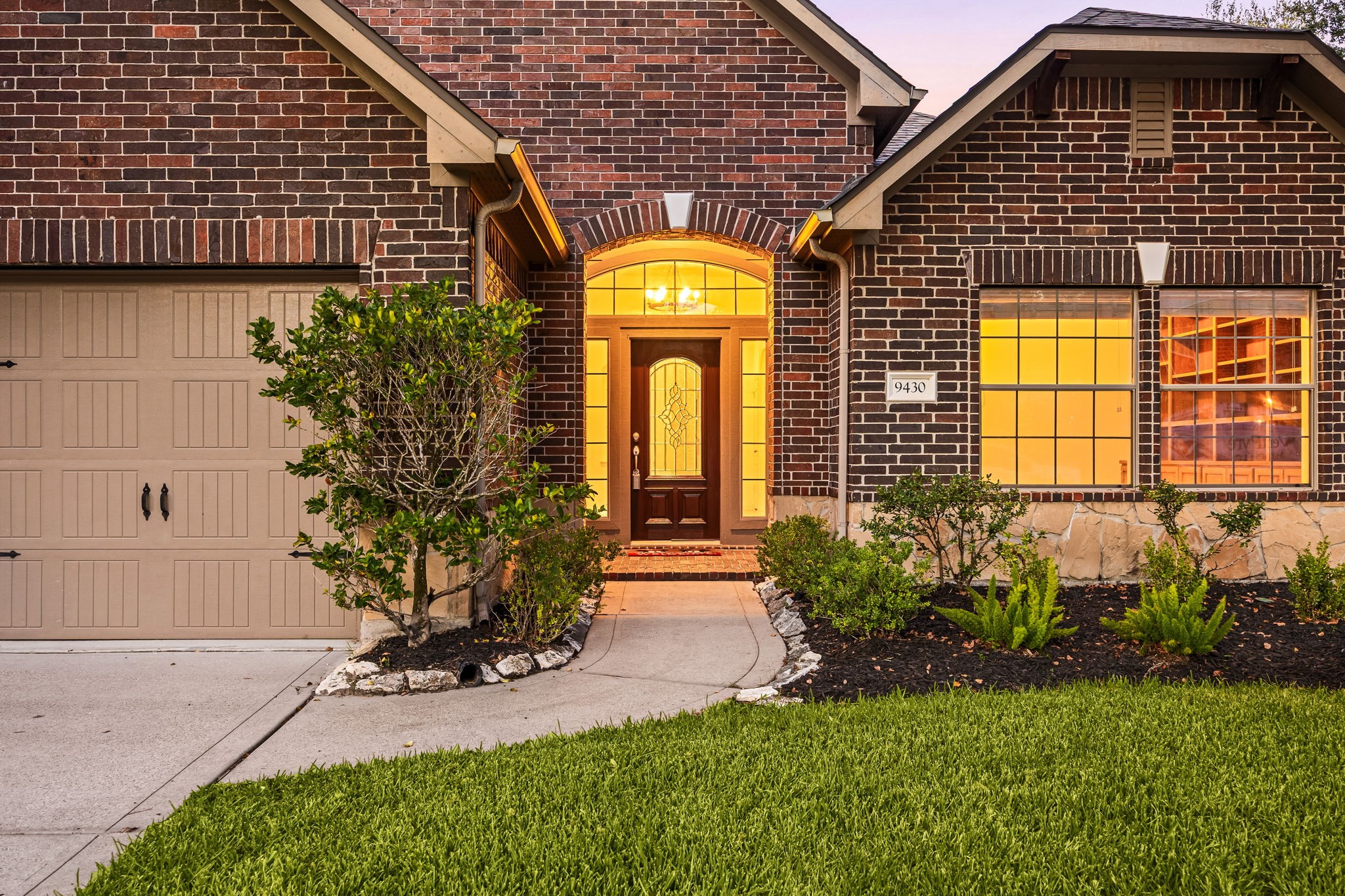 A welcoming, curved walkway sets the stage for exceptional curb appeal, leading you directly to a grand arched entryway where a classic glass-paneled front door beckons you inside. The beautifully detailed brick facade and pristine front landscaping immediately establish an inviting first impression before you even step across the threshold. A welcoming, curved walkway sets the stage for exceptional curb appeal, leading you directly to a grand arched entryway where a classic glass-paneled front door beckons you inside. The beautifully detailed brick facade and pristine front landscaping immediately establish an inviting first impression before you even step across the threshold.