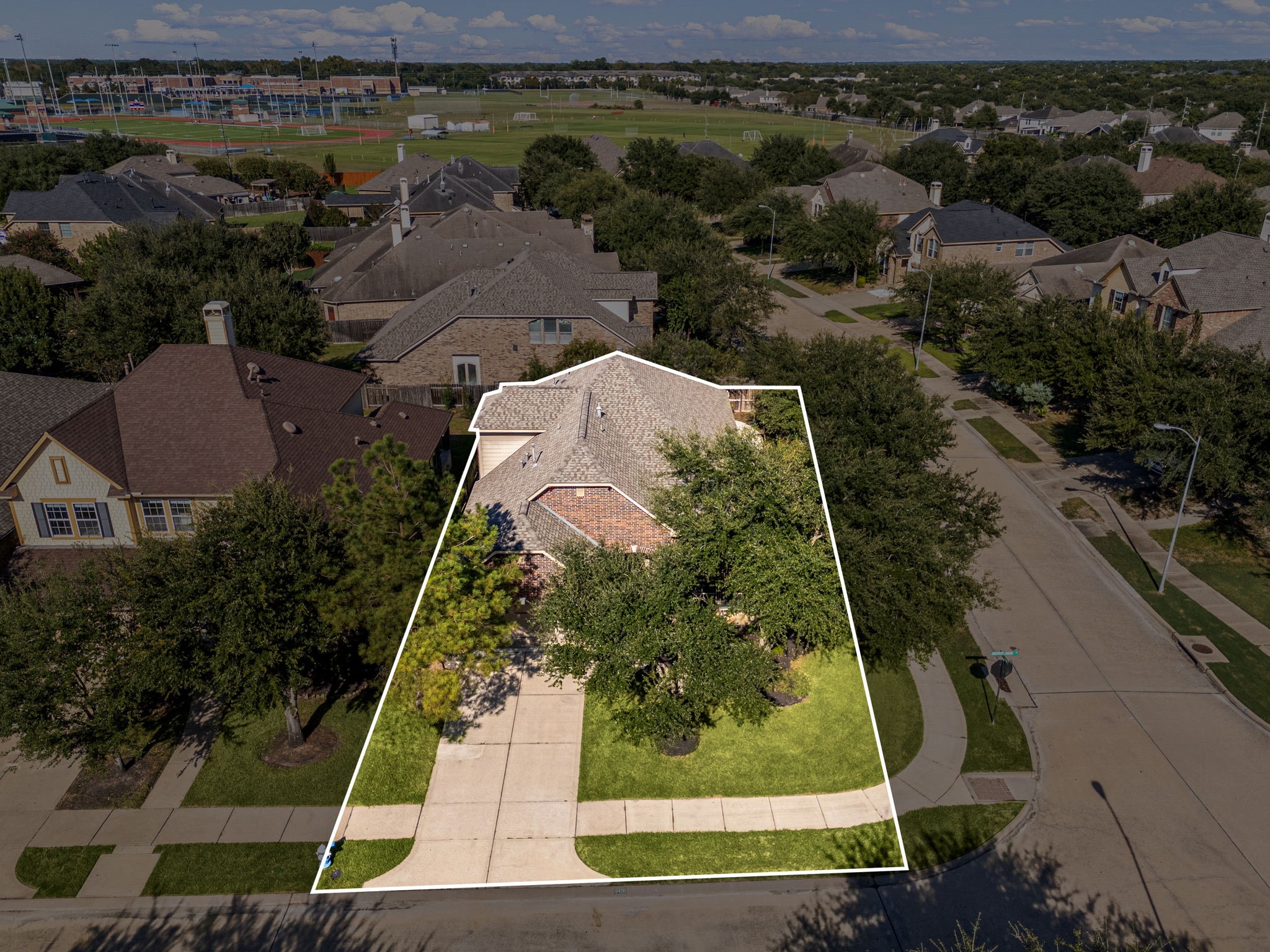 This home sits on a large lot with ample yard space in front and the back, lush landscaping and a well-maintained yard. Plenty of space to accommodate guest parking and situated on a corner lot. This home sits on a large lot with ample yard space in front and the back, lush landscaping and a well-maintained yard. Plenty of space to accommodate guest parking and situated on a corner lot.