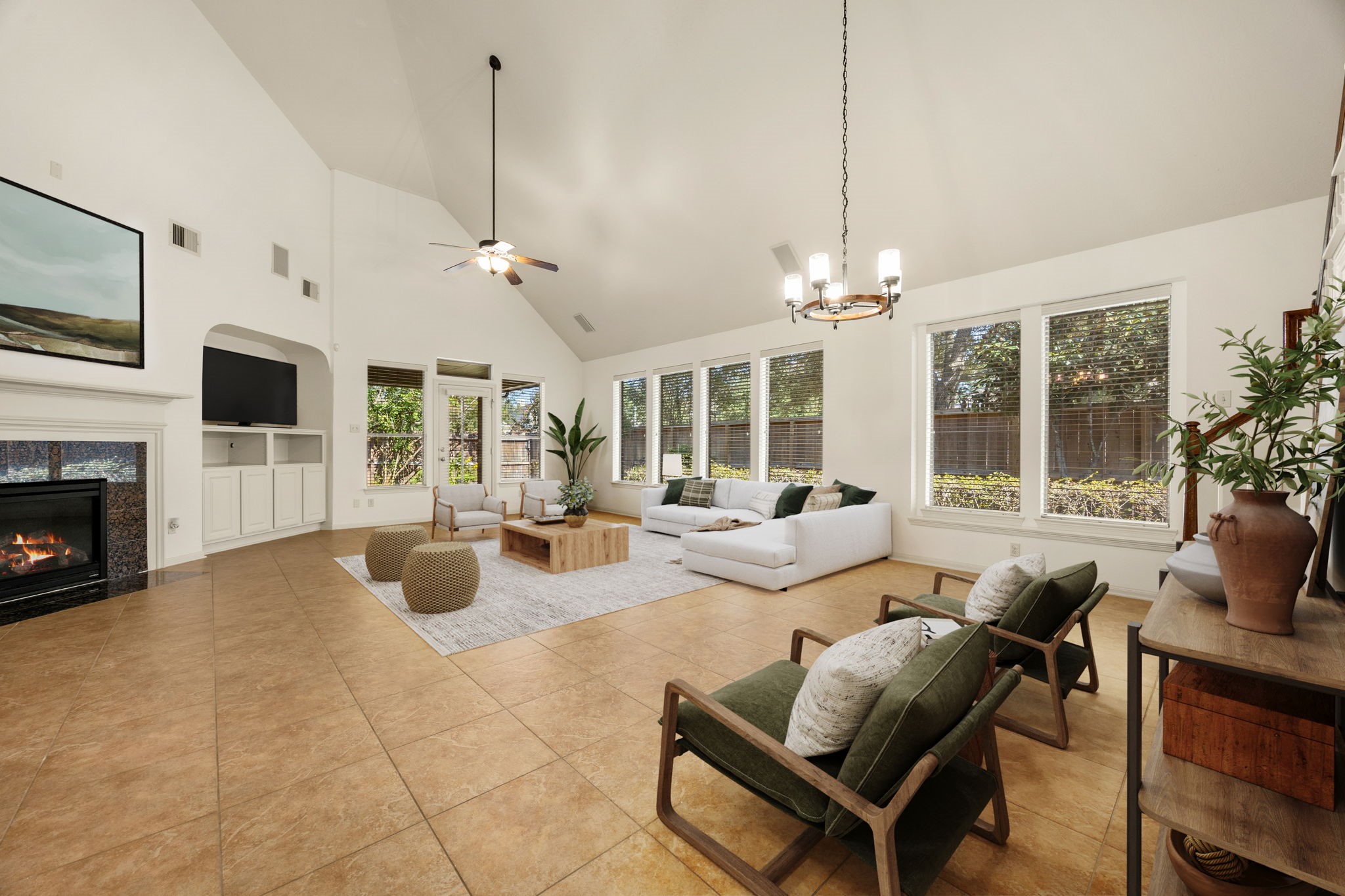 Step into the heart of the home, a magnificent family room where towering vaulted ceilings and an impressive wall of windows create an airy, light-filled sanctuary. *Virtually Staged