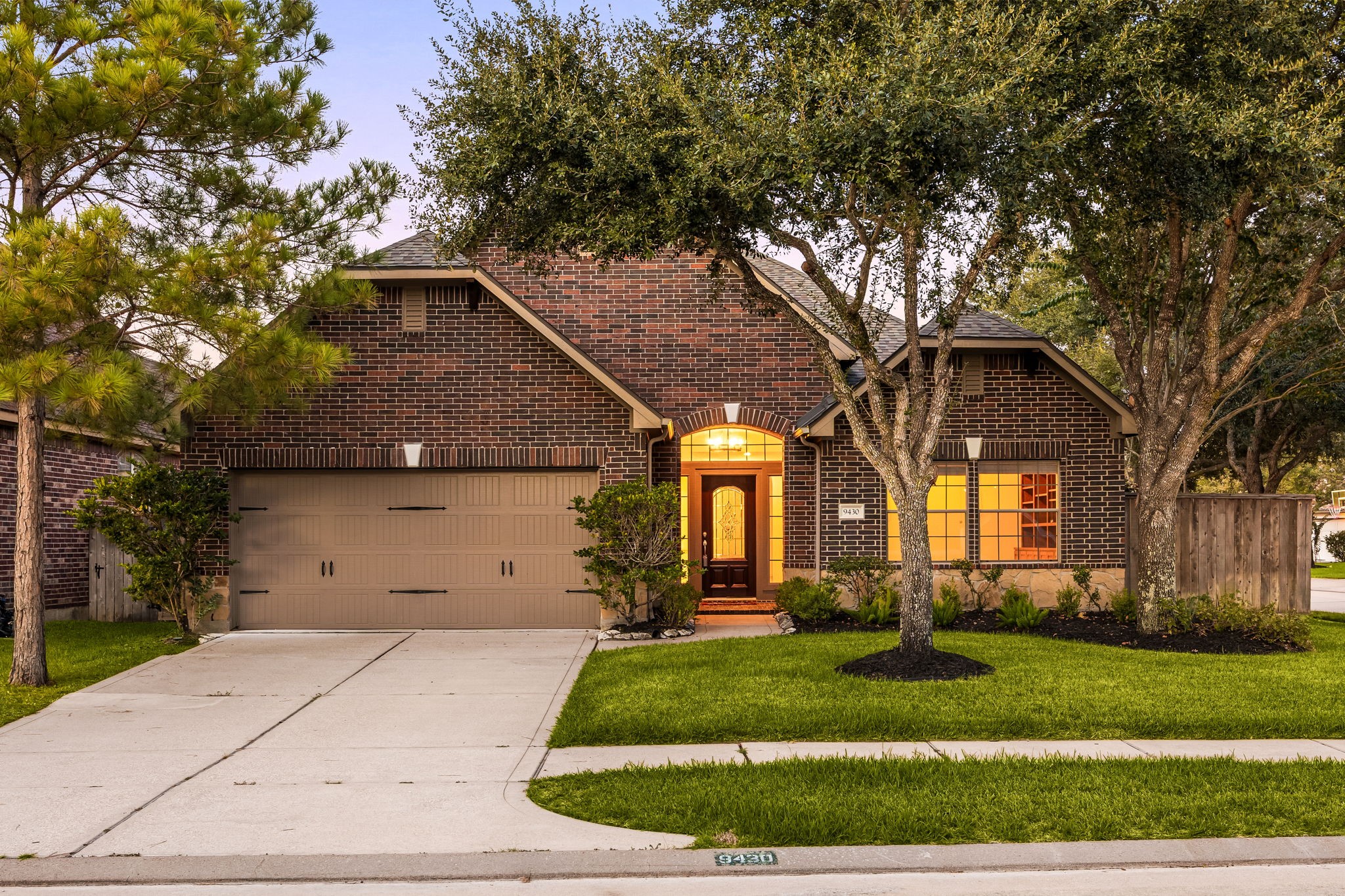 Welcome home to 9430 Amethyst Arbor lane located on corner lot in Cinco Ranch Southwest and zoned to Katy ISD! This stunning home has lovely curb appeal, a well-manicured lawn, beautiful landscaping, dark stained front door with glass detailing, covered front porch, traditional style, and a double wide driveway!