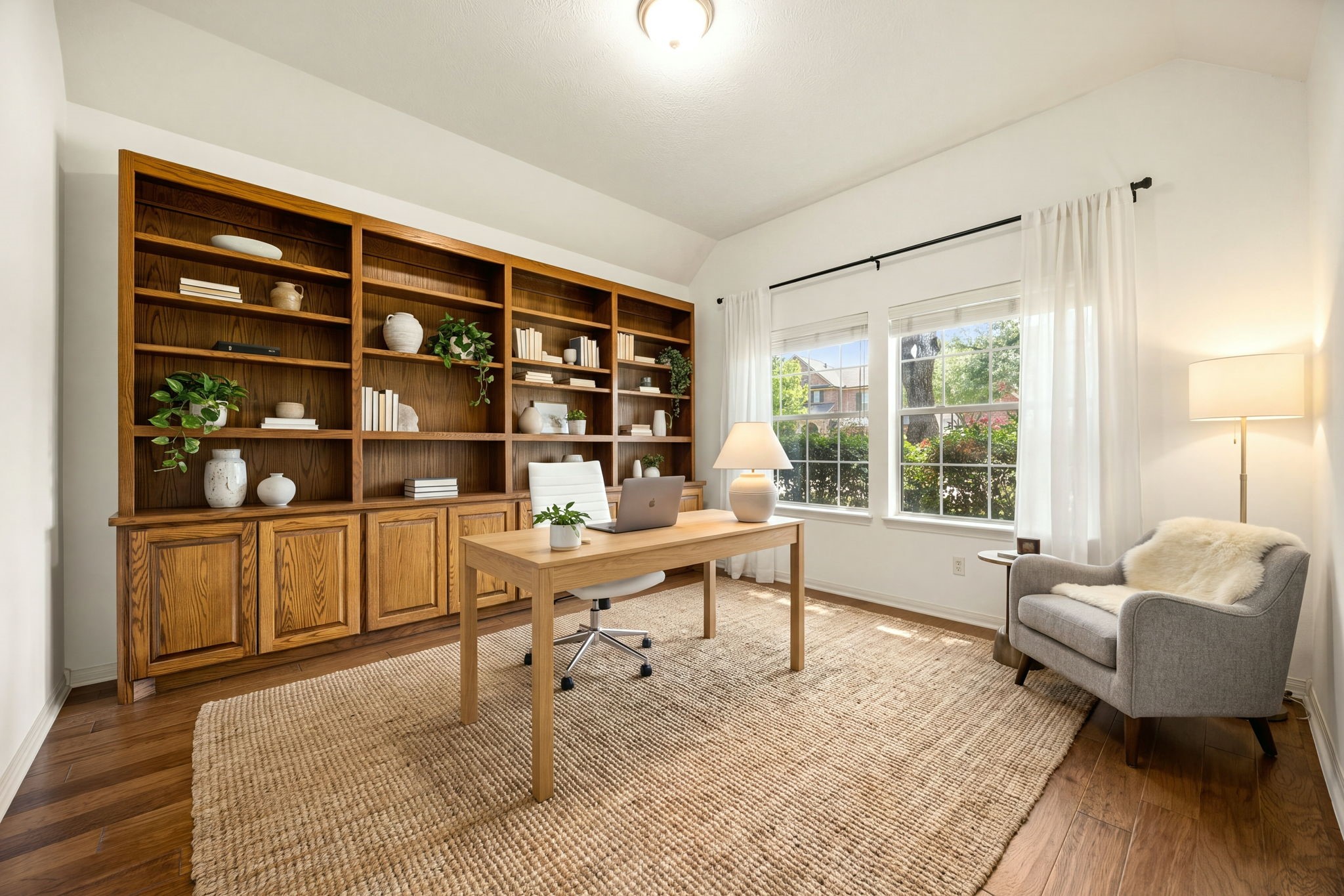 Tucked quietly away, this exceptional home office features a massive, full-wall custom oak bookcase that anchors the room with classic character. *Virtually Staged - custom oak bookcase is not virtual and is in the home. Tucked quietly away, this exceptional home office features a massive, full-wall custom oak bookcase that anchors the room with classic character. *Virtually Staged - custom oak bookcase is not virtual and is in the home.