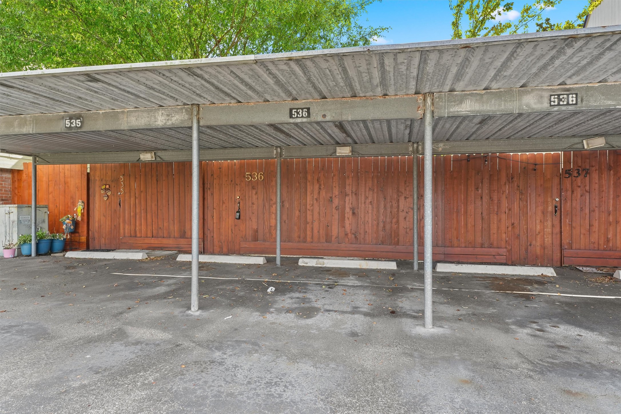 2 assigned carports for the unit, right outside the rear gate