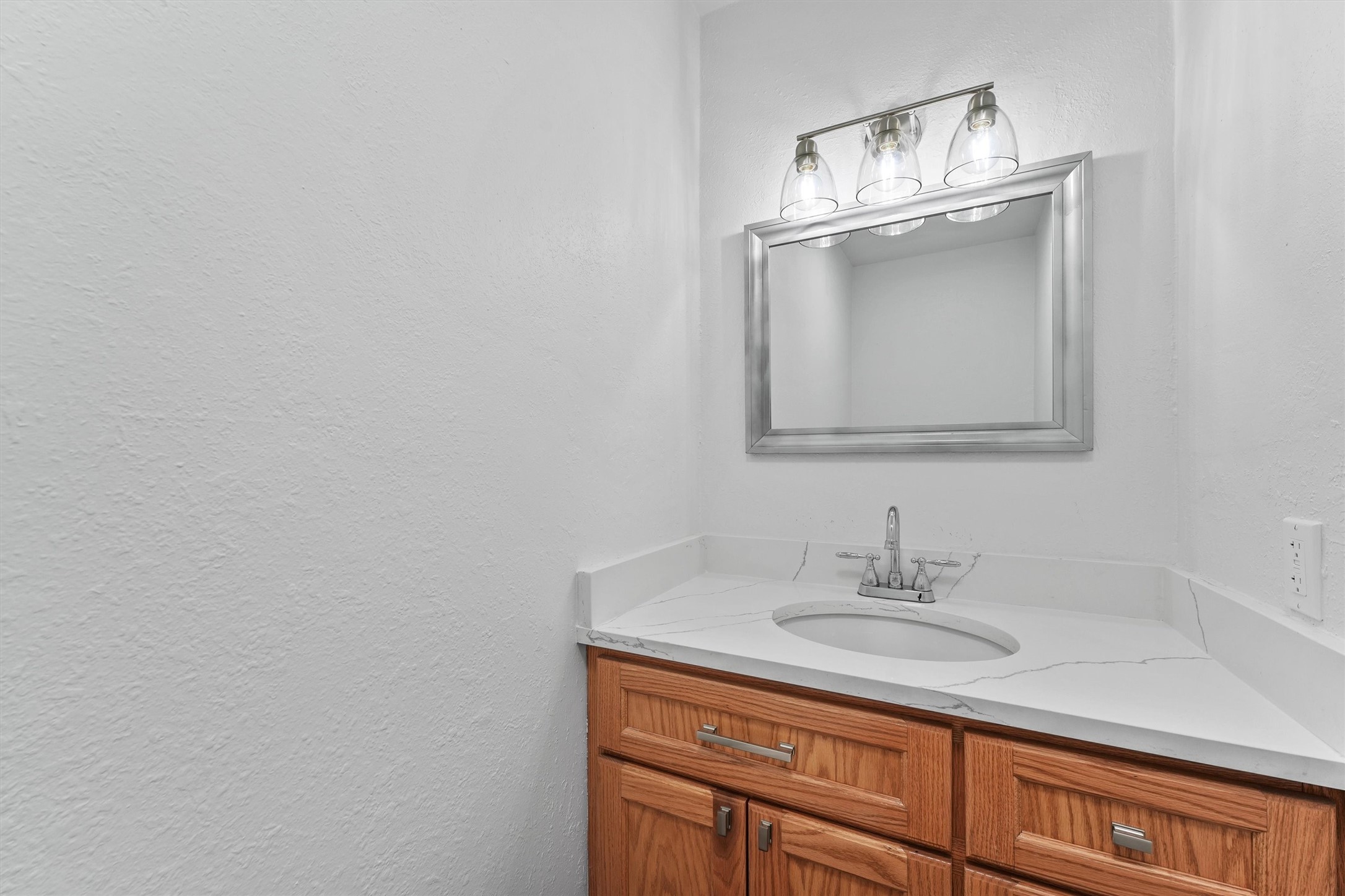 Half bath with quartz countertop on the 1st floor