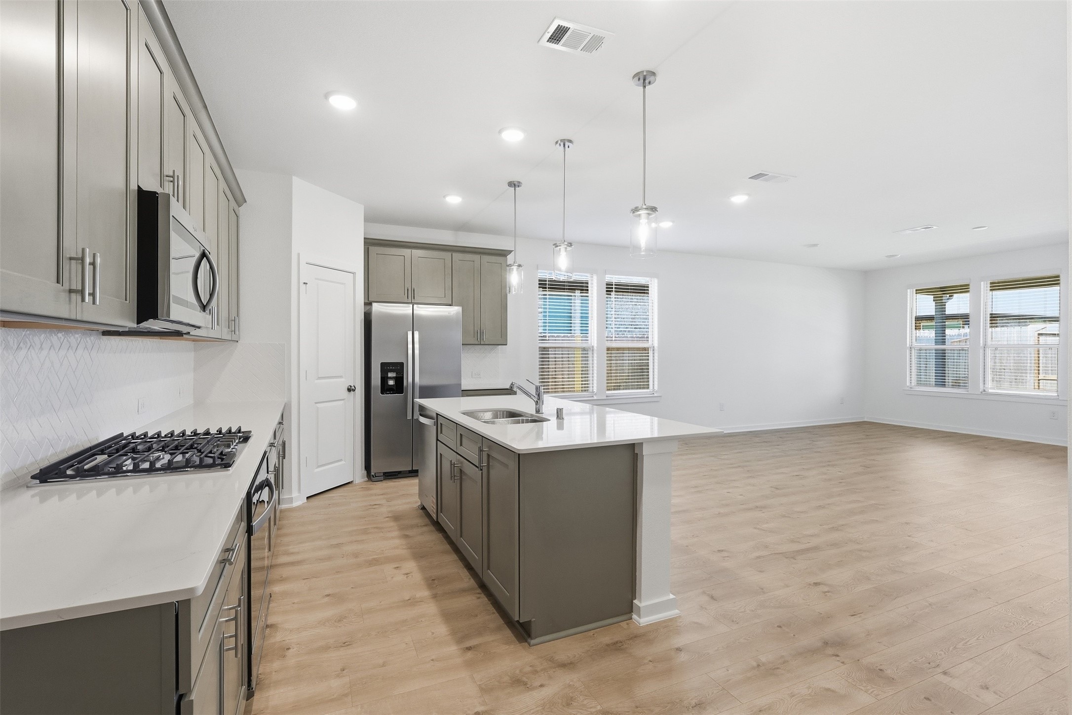 Island Kitchen opens to dining and family room. Island Kitchen opens to dining and family room.