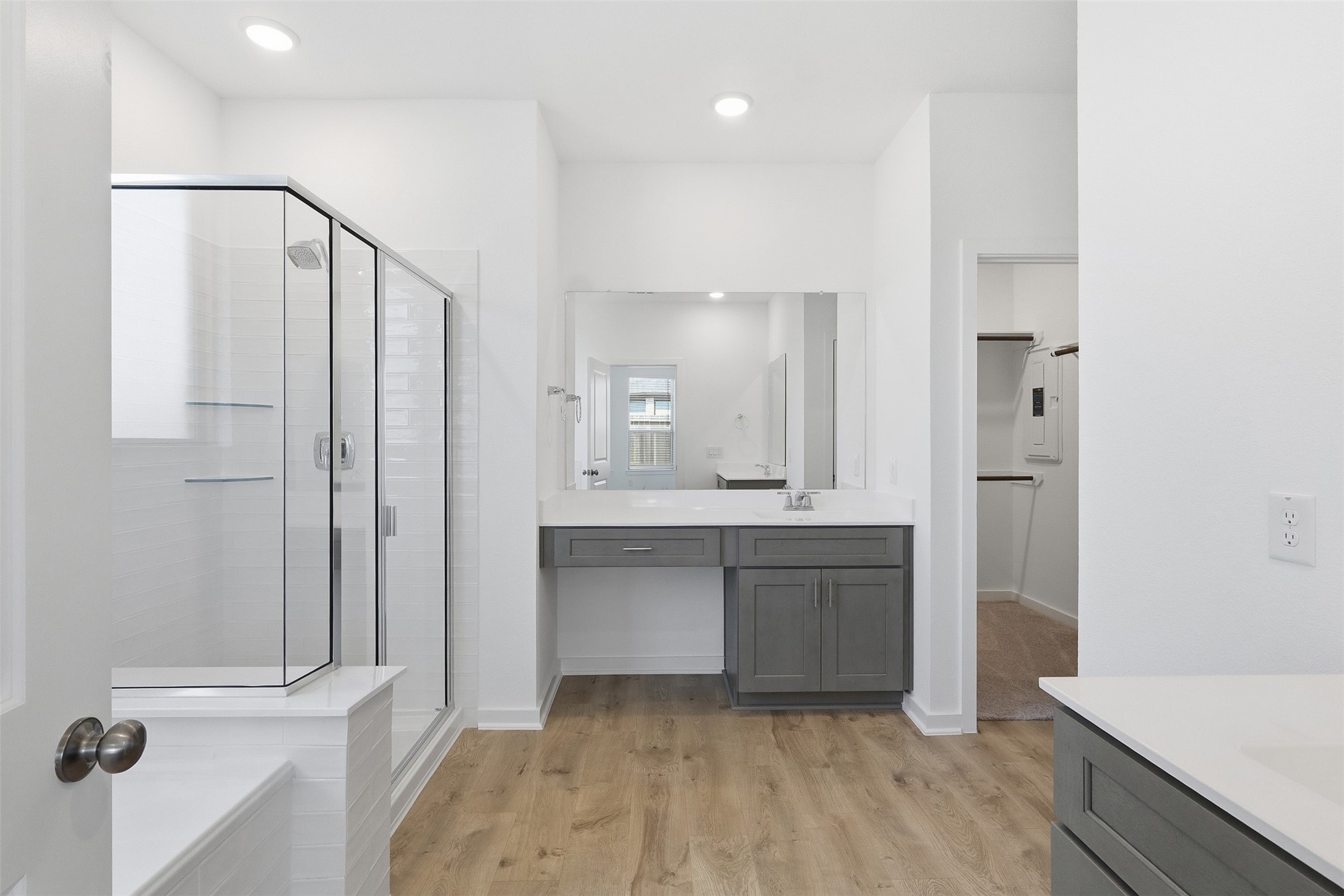 Primary Bath features two sinks, a vnaity, soaking tuba and separate shower.