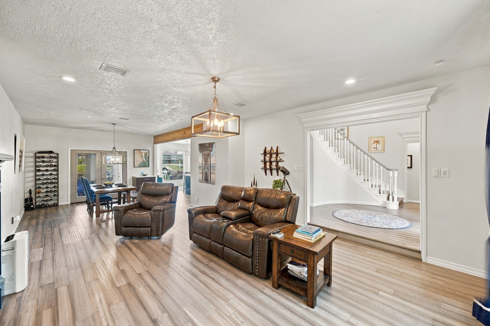 The spacious living area has an open-concept layout that flows into the kitchen and dining areas. The spacious living area has an open-concept layout that flows into the kitchen and dining areas.