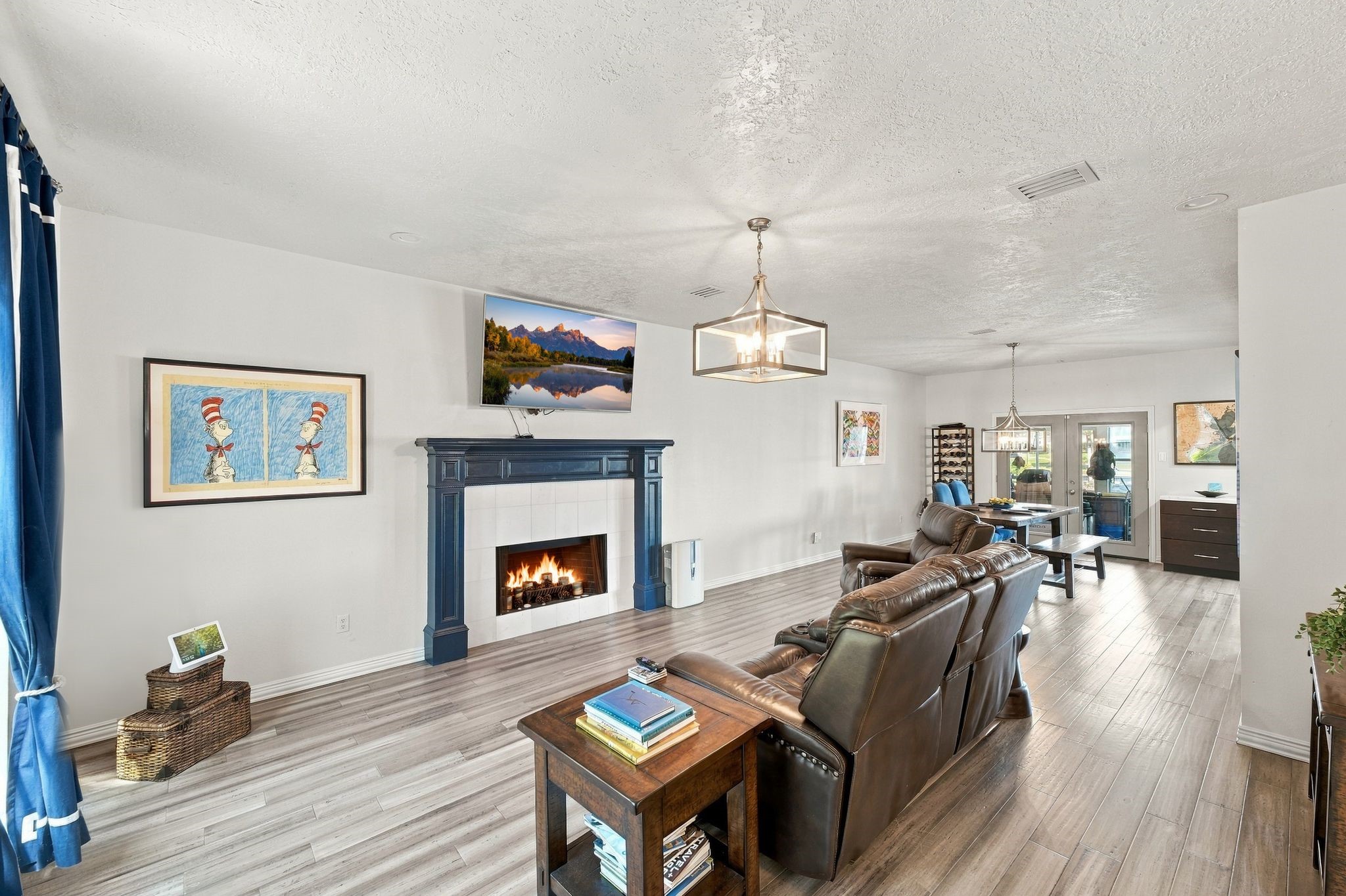 The family room features a wood-burning fireplace and updated flooring. The family room features a wood-burning fireplace and updated flooring.