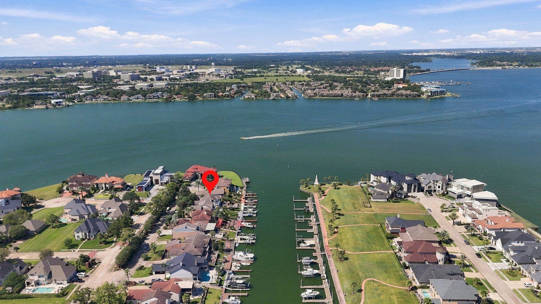 Additional aerial view of the home's canal-front location on Clear Lake.