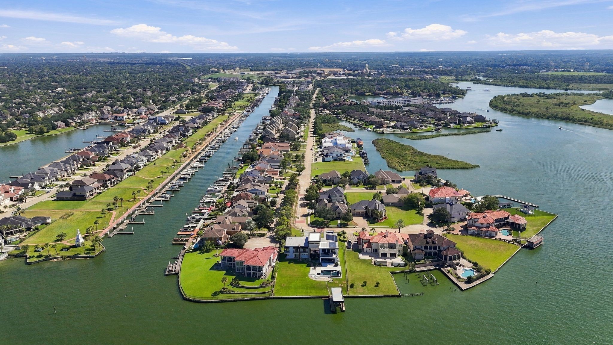 The Clear Lake Plantation Patio Homes community sits on a peninsula surrounded by water.