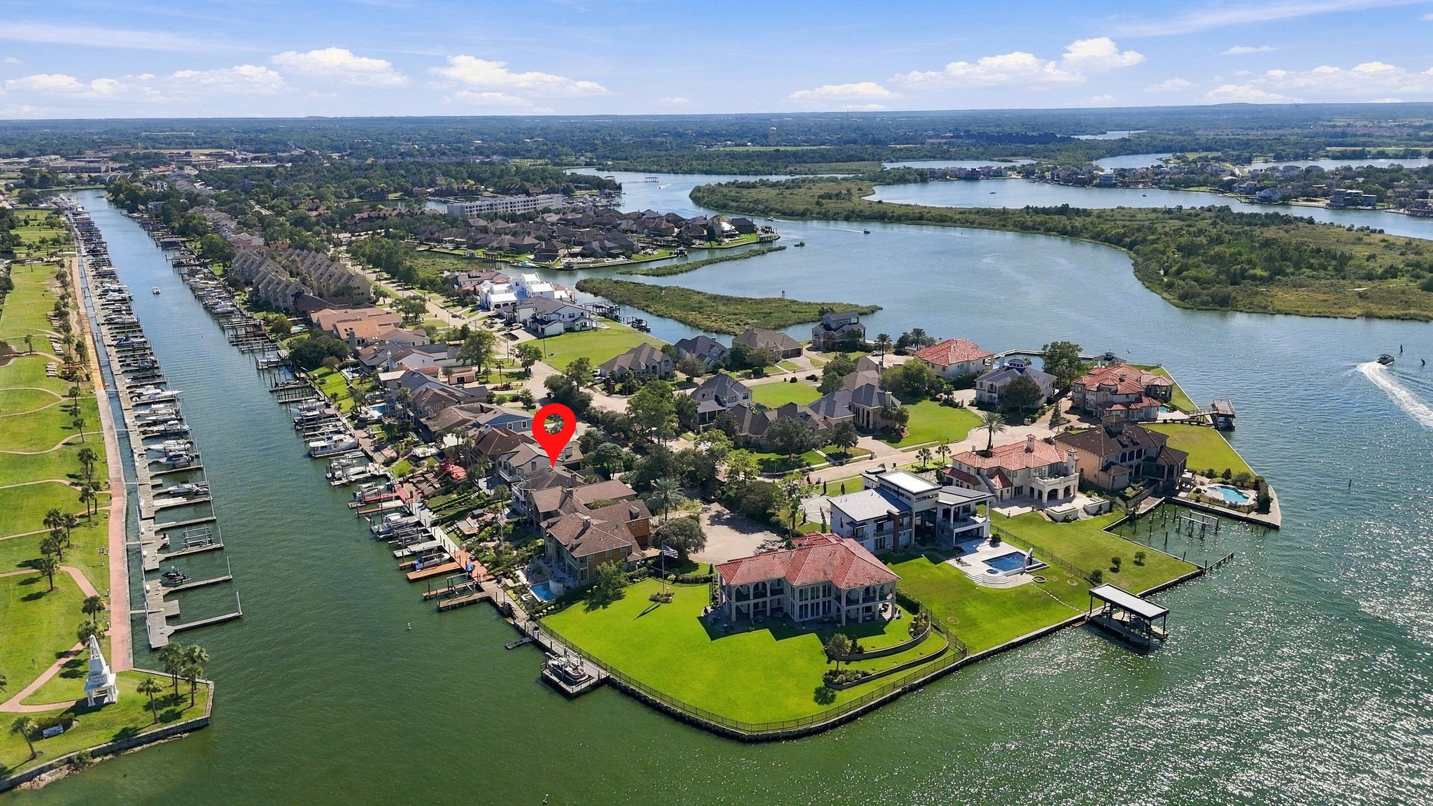 Additional aerial view of the community and the lake.
