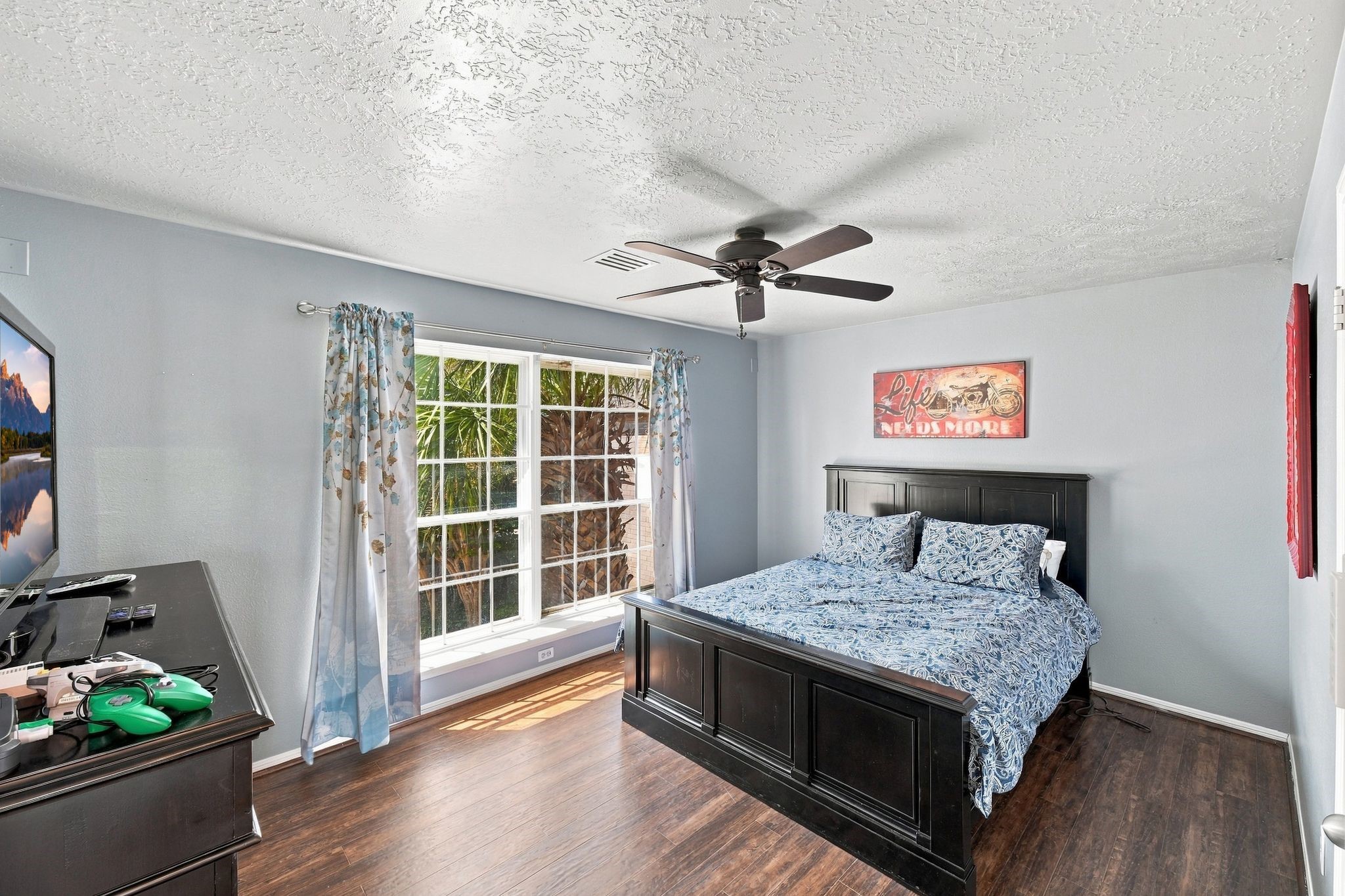 The secondary bedroom features a large window with views of the water.