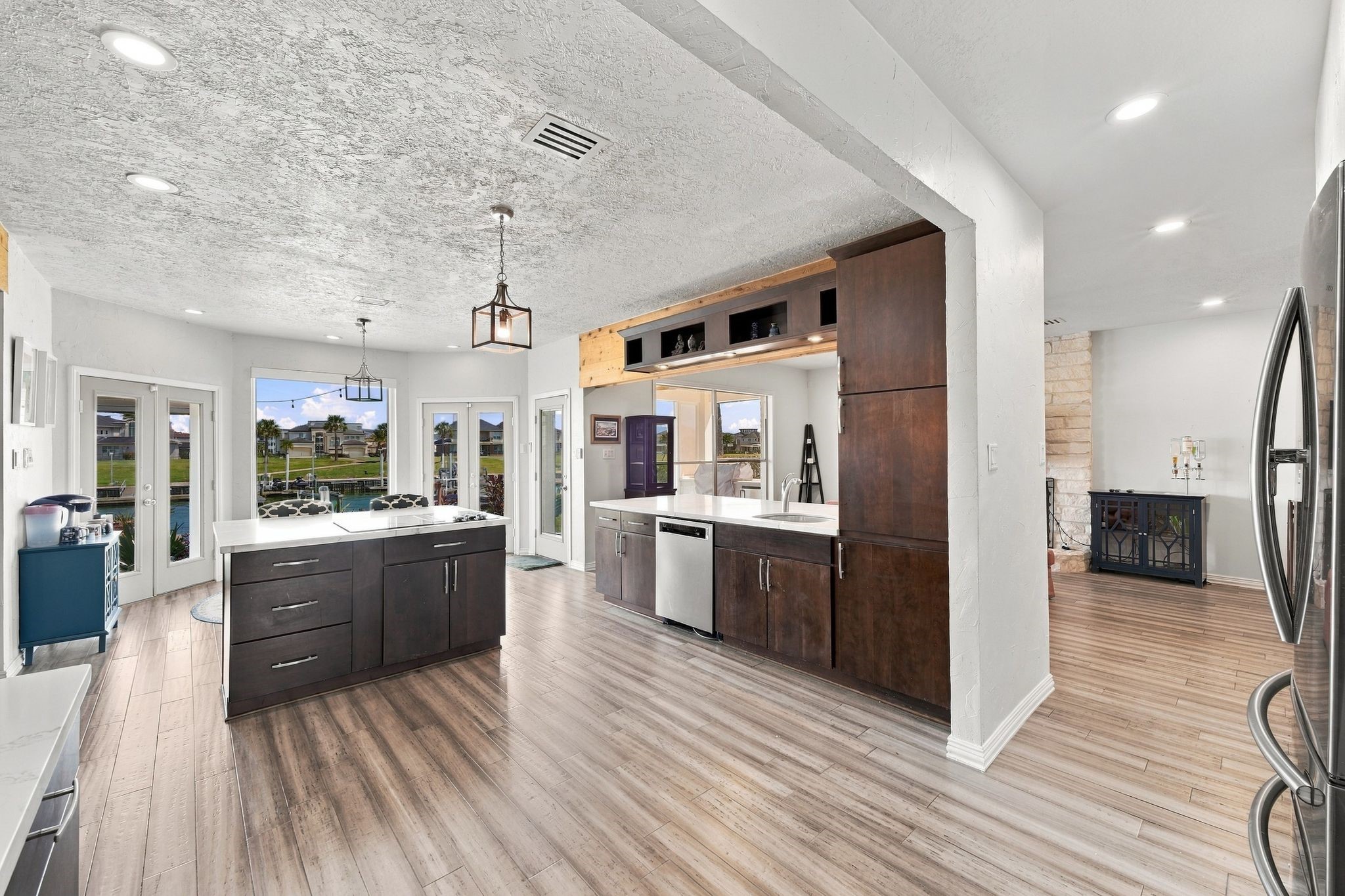 The kitchen is open to the family room and features rich dark cabinetry and a center island.