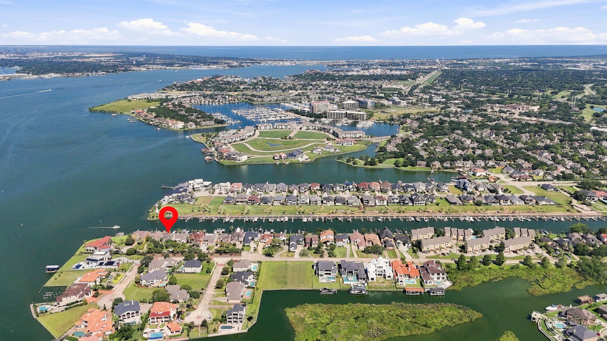 An aerial view shows the home's location on Clear Lake, with easy access to open water.