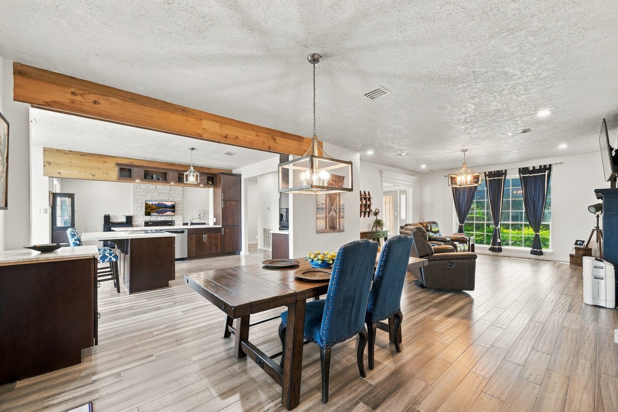 The dining area is open to the kitchen, making it easy to host gatherings and entertain.