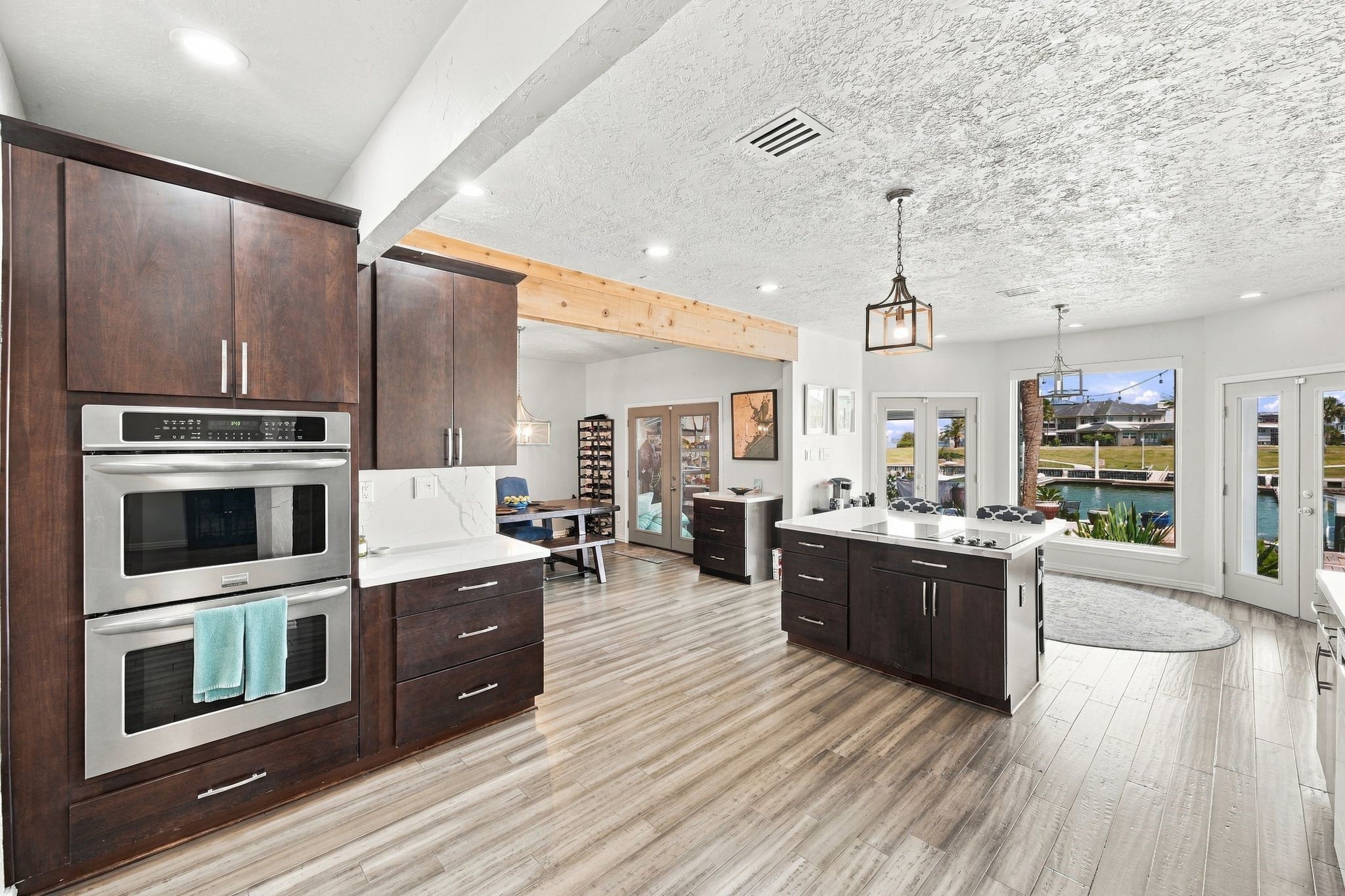 Double wall ovens and ample cabinetry offer plenty of storage and cooking space.