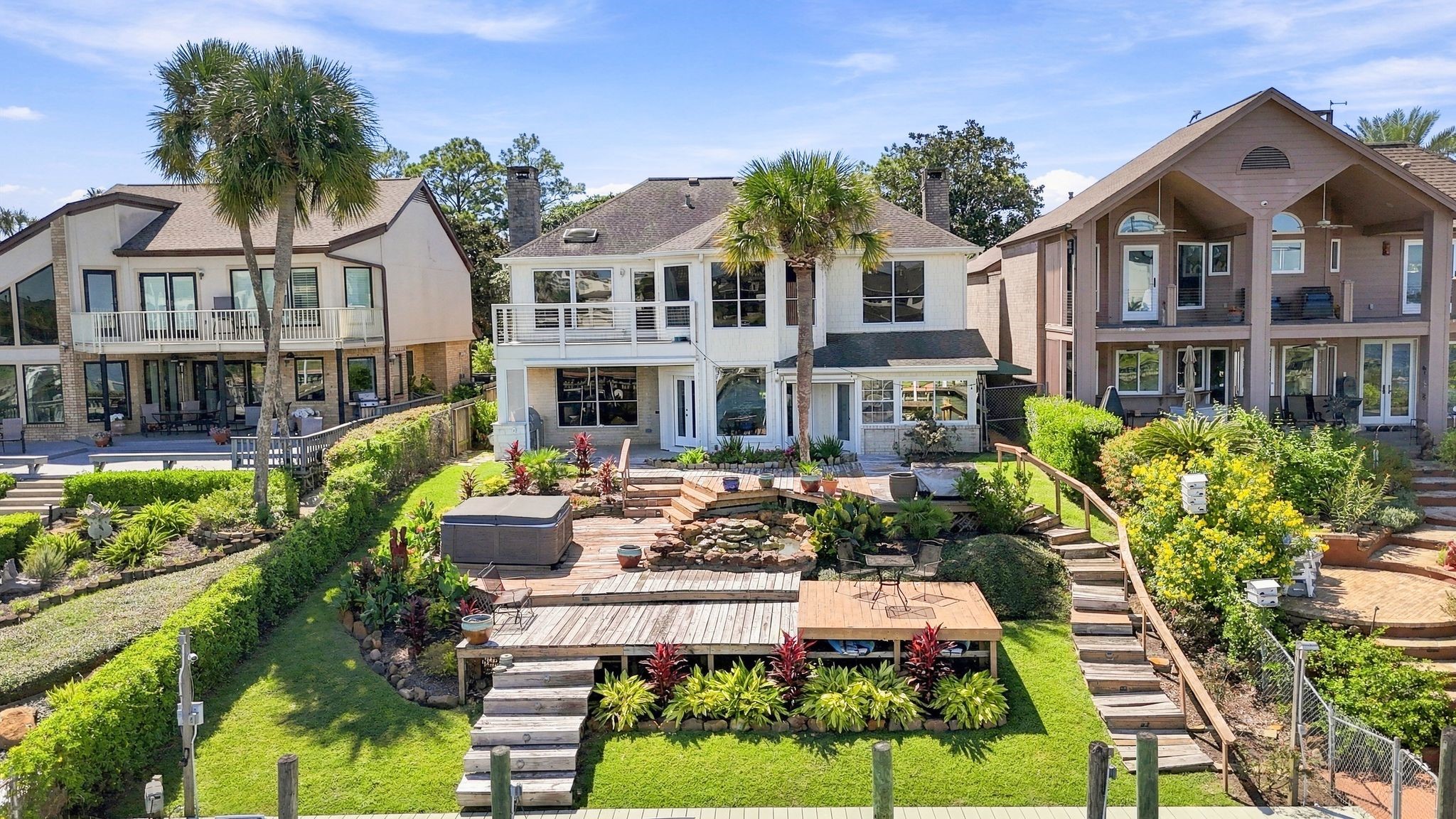 Additional aerial view of the home and backyard.