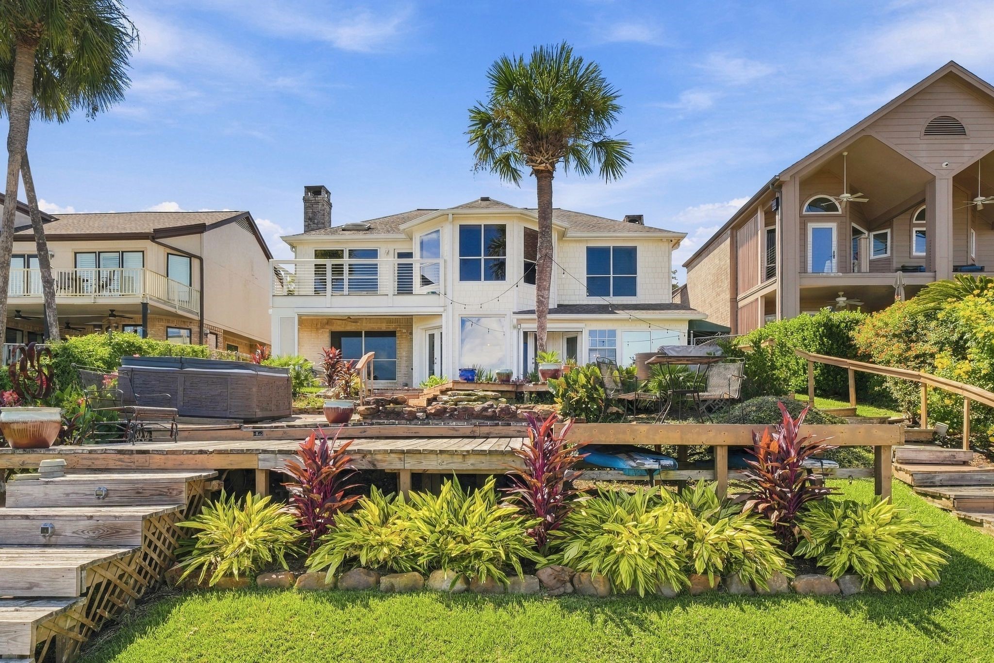 The back of the home sits above beautifully landscaped terraced gardens.