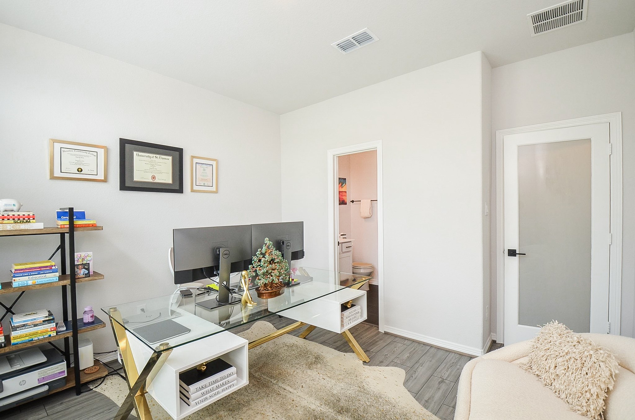 Bright home office featuring a cozy seating area, perfect for productivity and comfort.