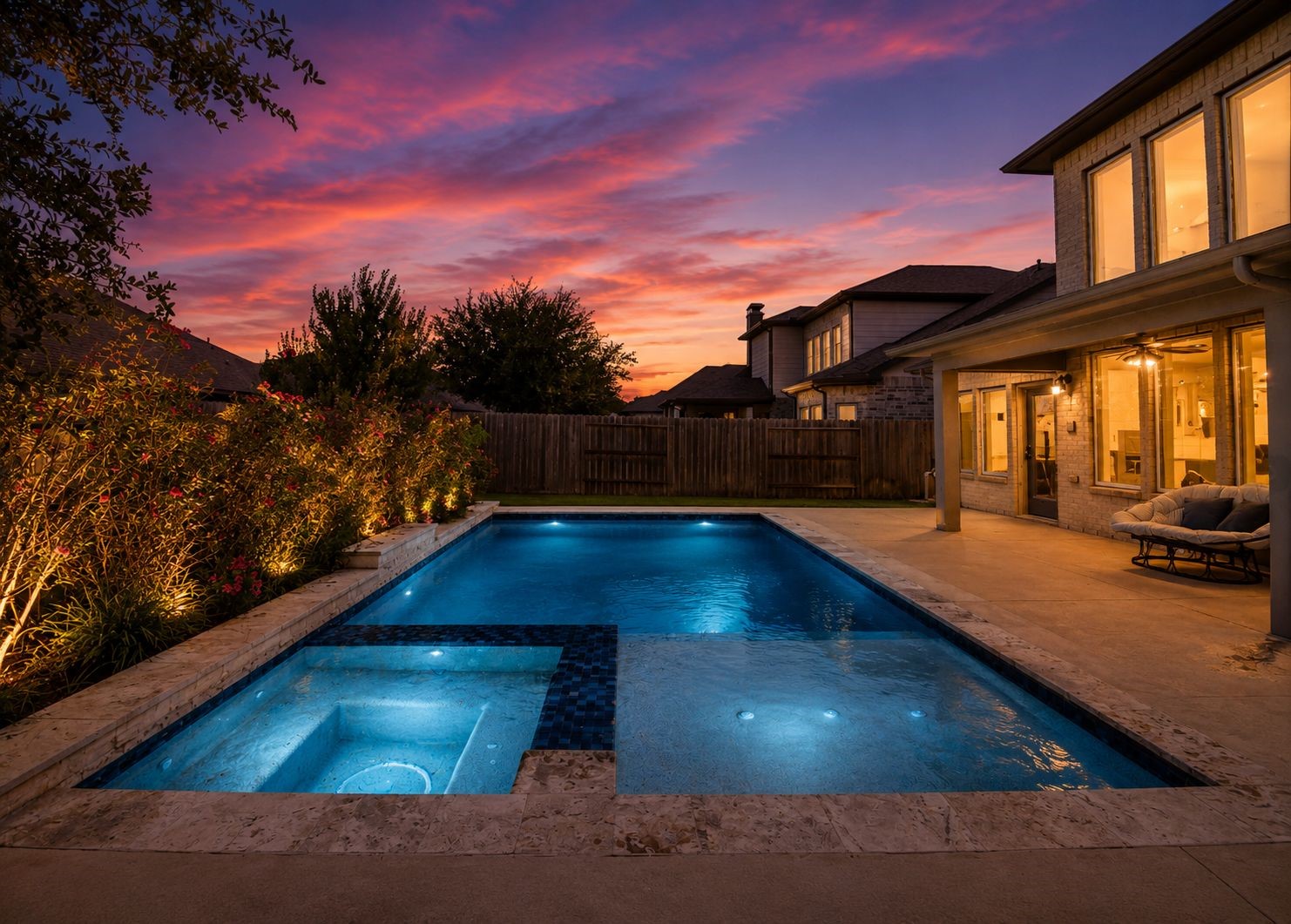 Experience luxury living with a beautifully lit pool and spa, perfect for evening relaxation, set against a stunning sunset backdrop. Experience luxury living with a beautifully lit pool and spa, perfect for evening relaxation, set against a stunning sunset backdrop.