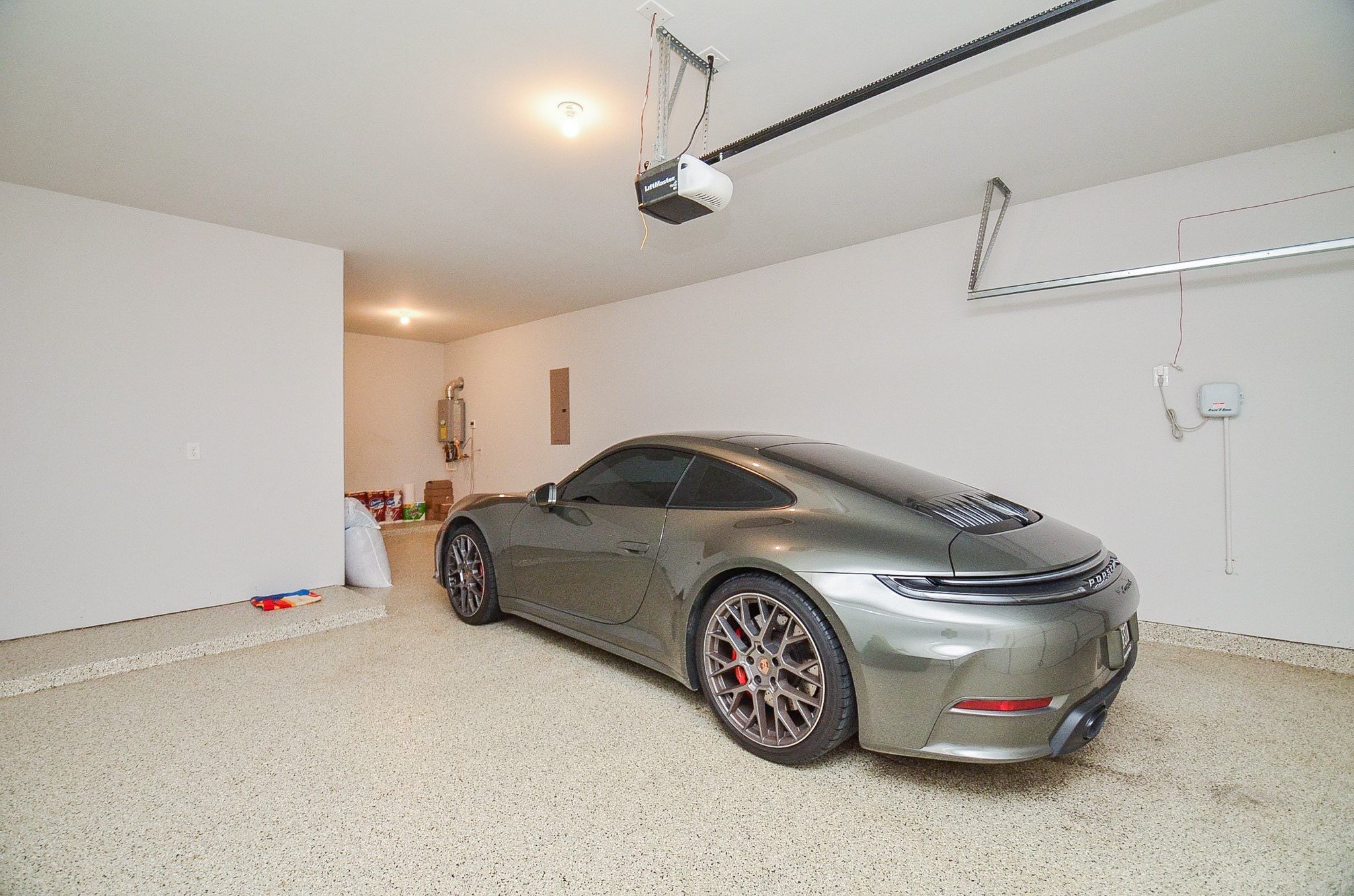 Spacious, well-lit garage with a sleek, modern design and ample room for parking and storage.