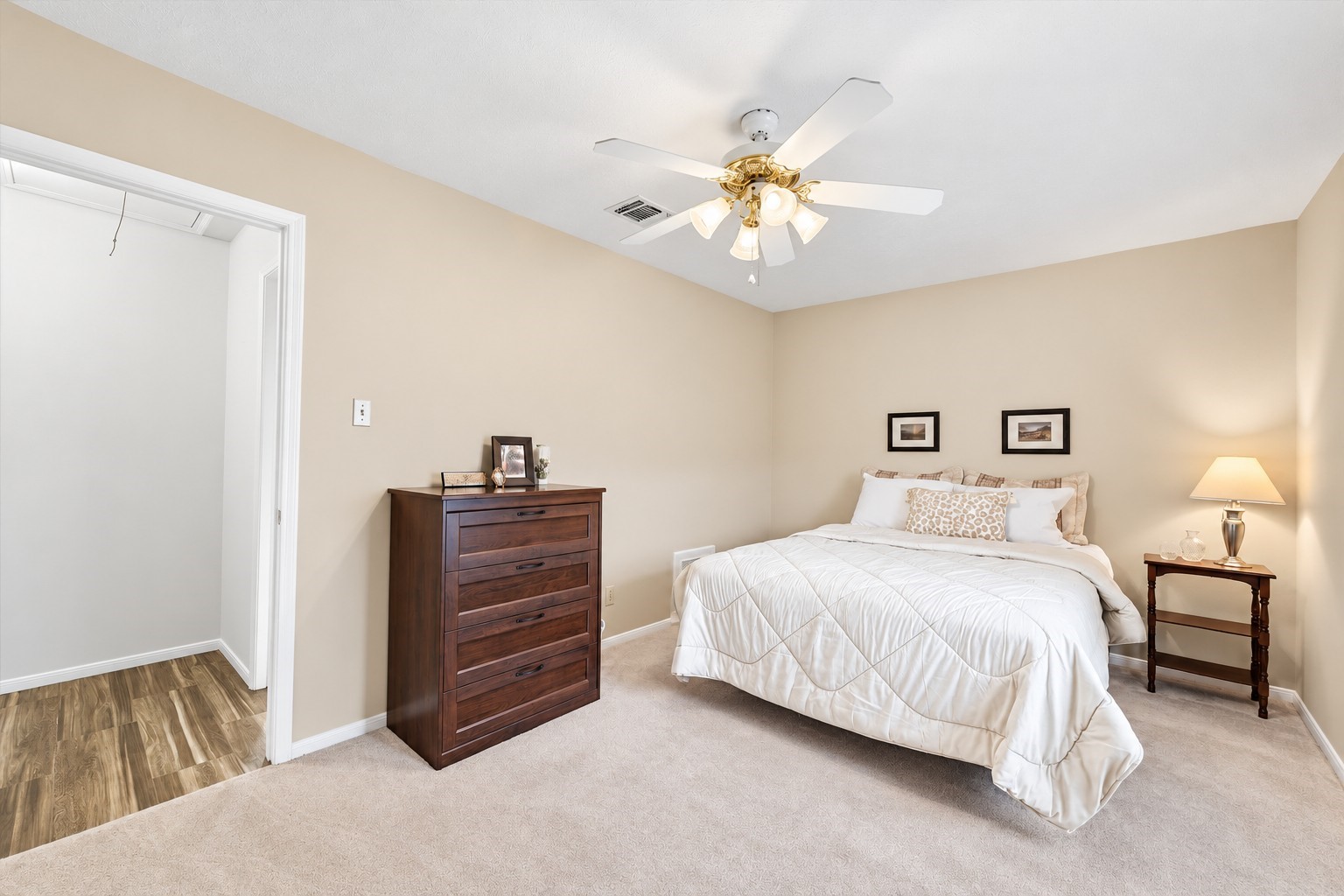 This spacious bedroom is just off the hall bath & has a ceiling fan & walk-in CEDAR closet!