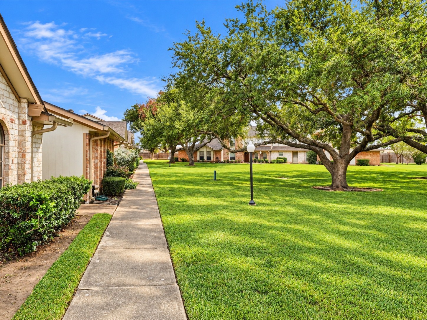 Enjoy the well maintained green space with mature shade trees outside your front door with a walkway to the pool or for a stroll. Enjoy the well maintained green space with mature shade trees outside your front door with a walkway to the pool or for a stroll.