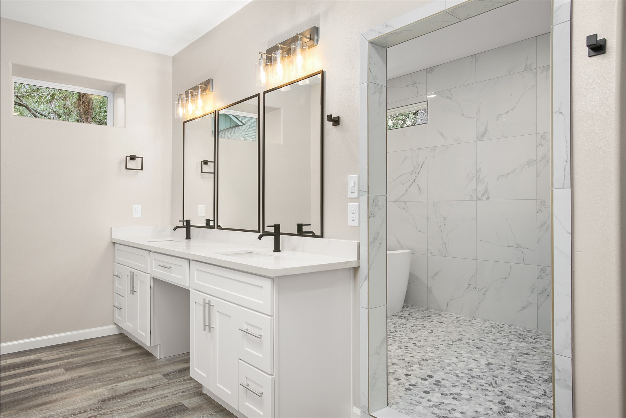 Primary bedroom with double vanity and oversized shower room