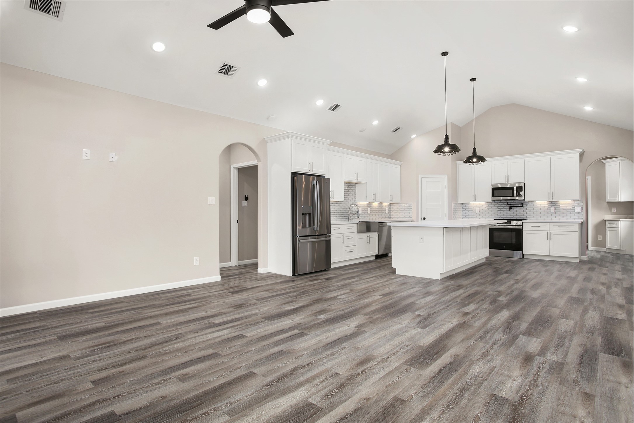 Living room and kitchen with faulted ceiling Living room and kitchen with faulted ceiling