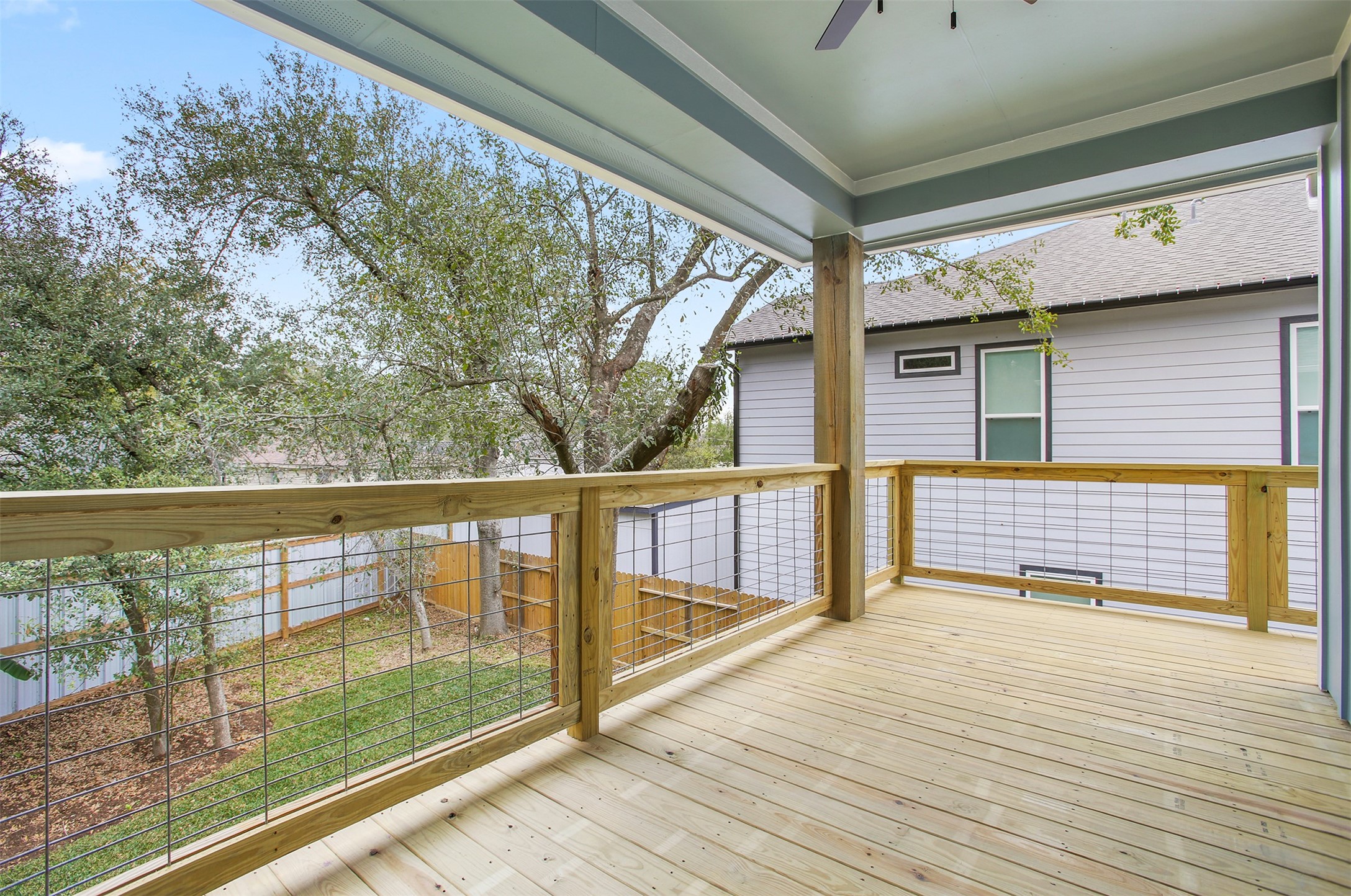 Upstairs back porch which wraps around to the front