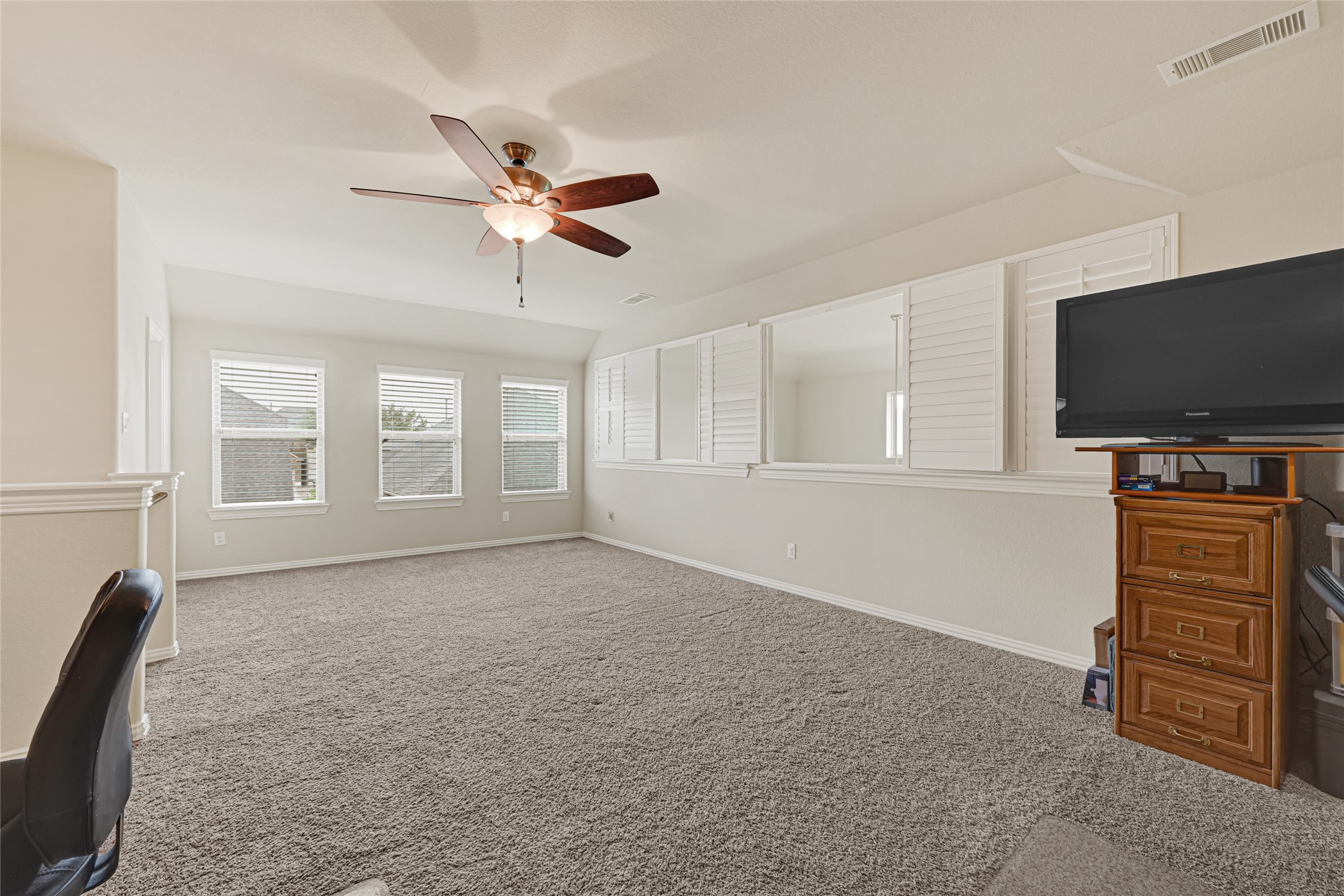 Enjoy the upstairs game room, media room or just another living area