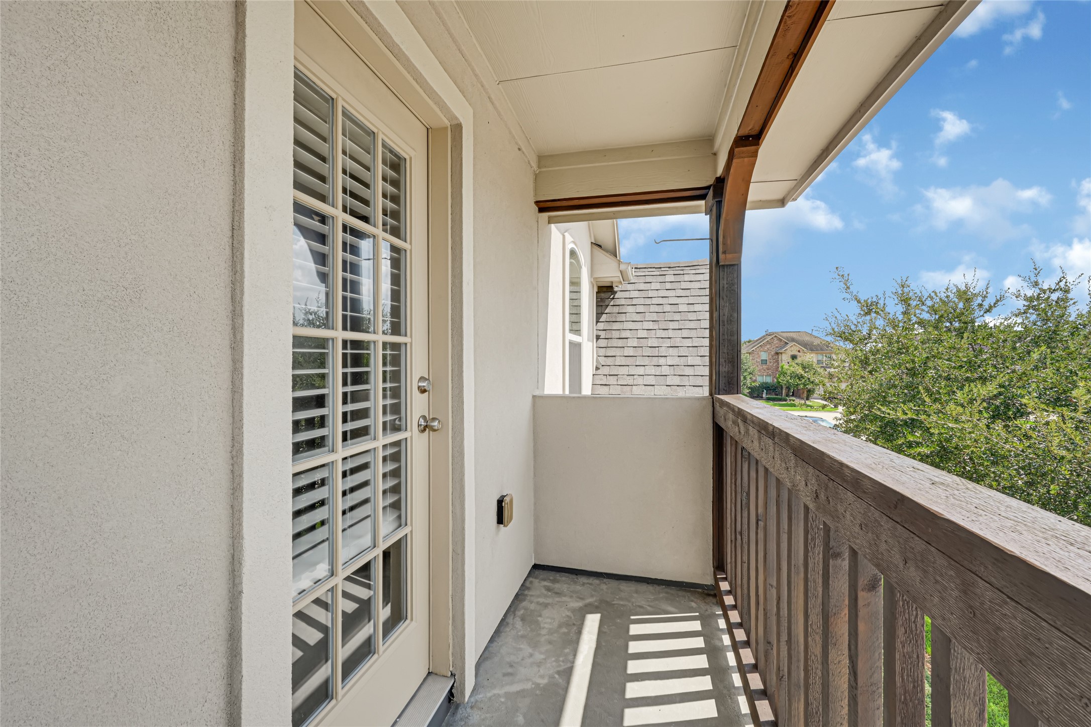 Enjoy this nice bedroom upstairs with a balcony.