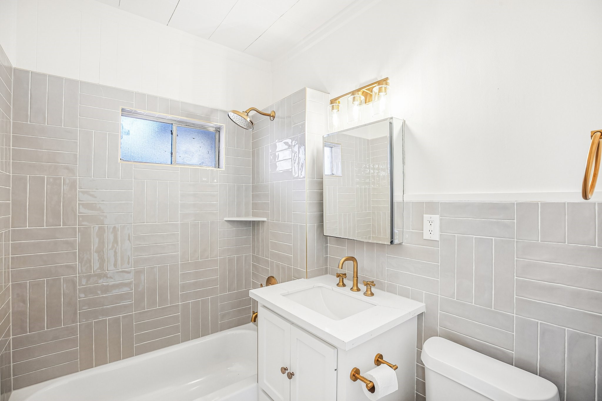 Ah, the bathroom! Brand new! A medicine cabinet provides extra storage