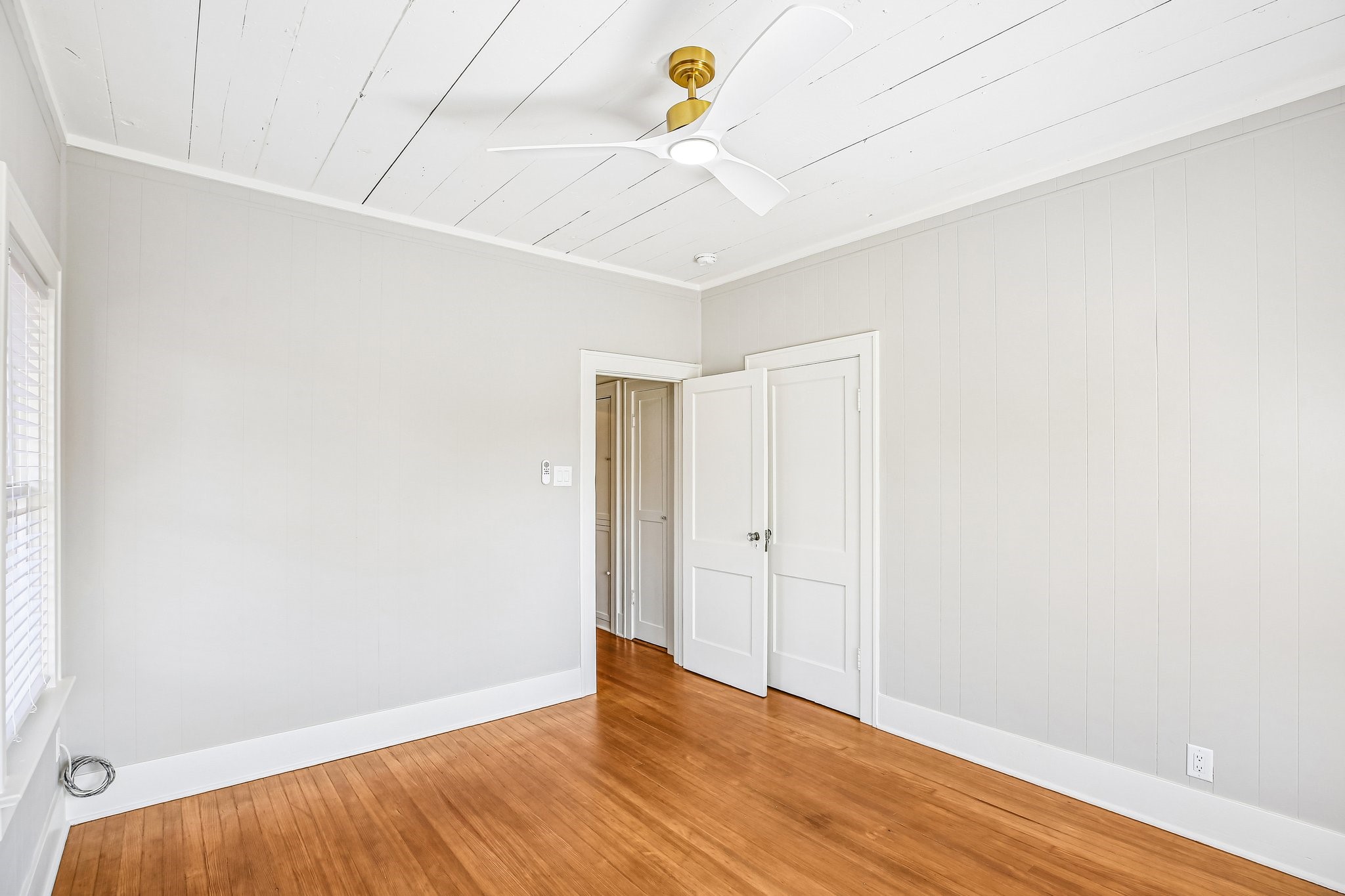 The bedroom (closet ahead to the right).