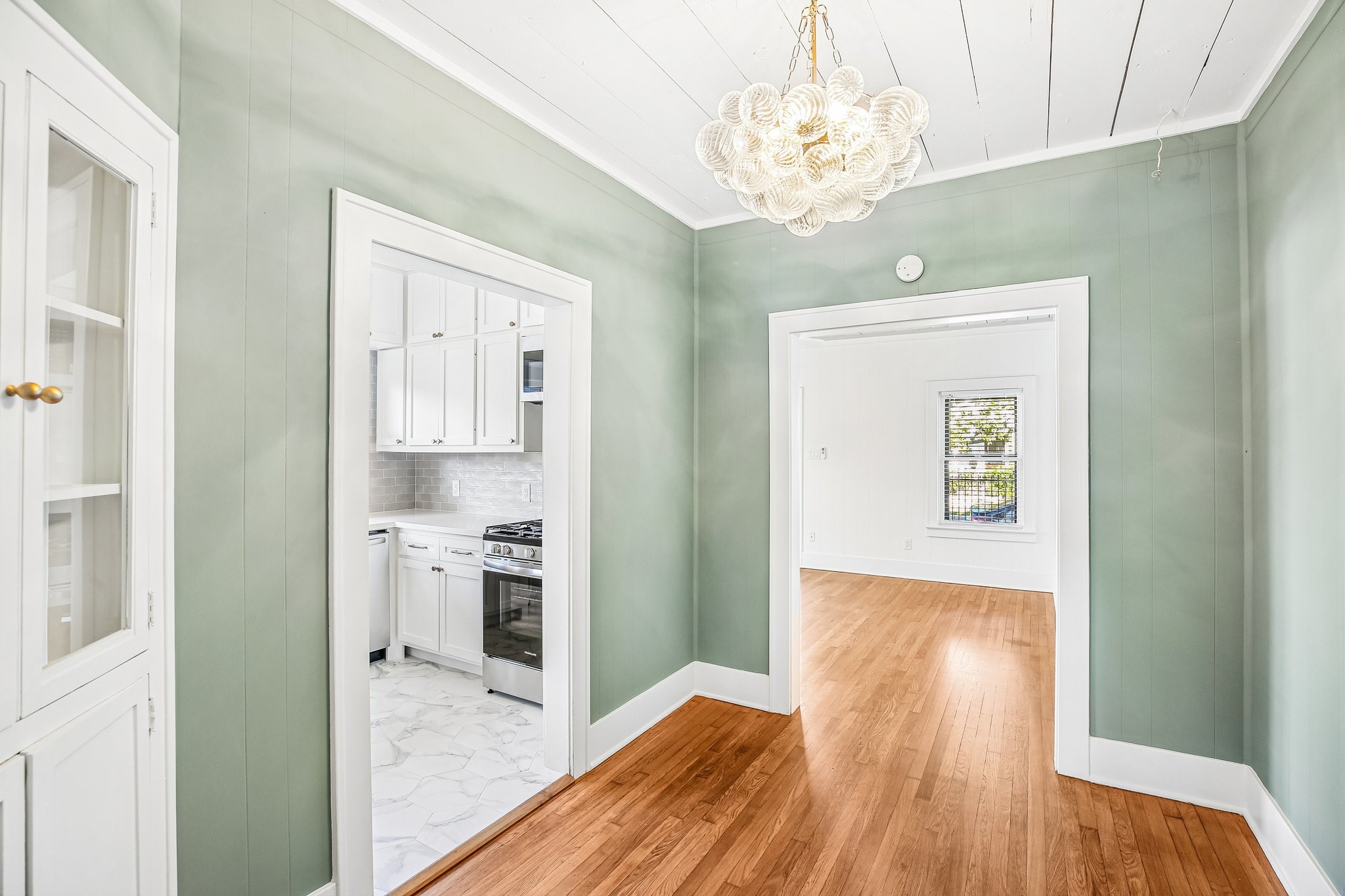 The dining room flows into the kitchen and also receives substantial light from the kitchen windows, which face West and enjoy afternoon light.