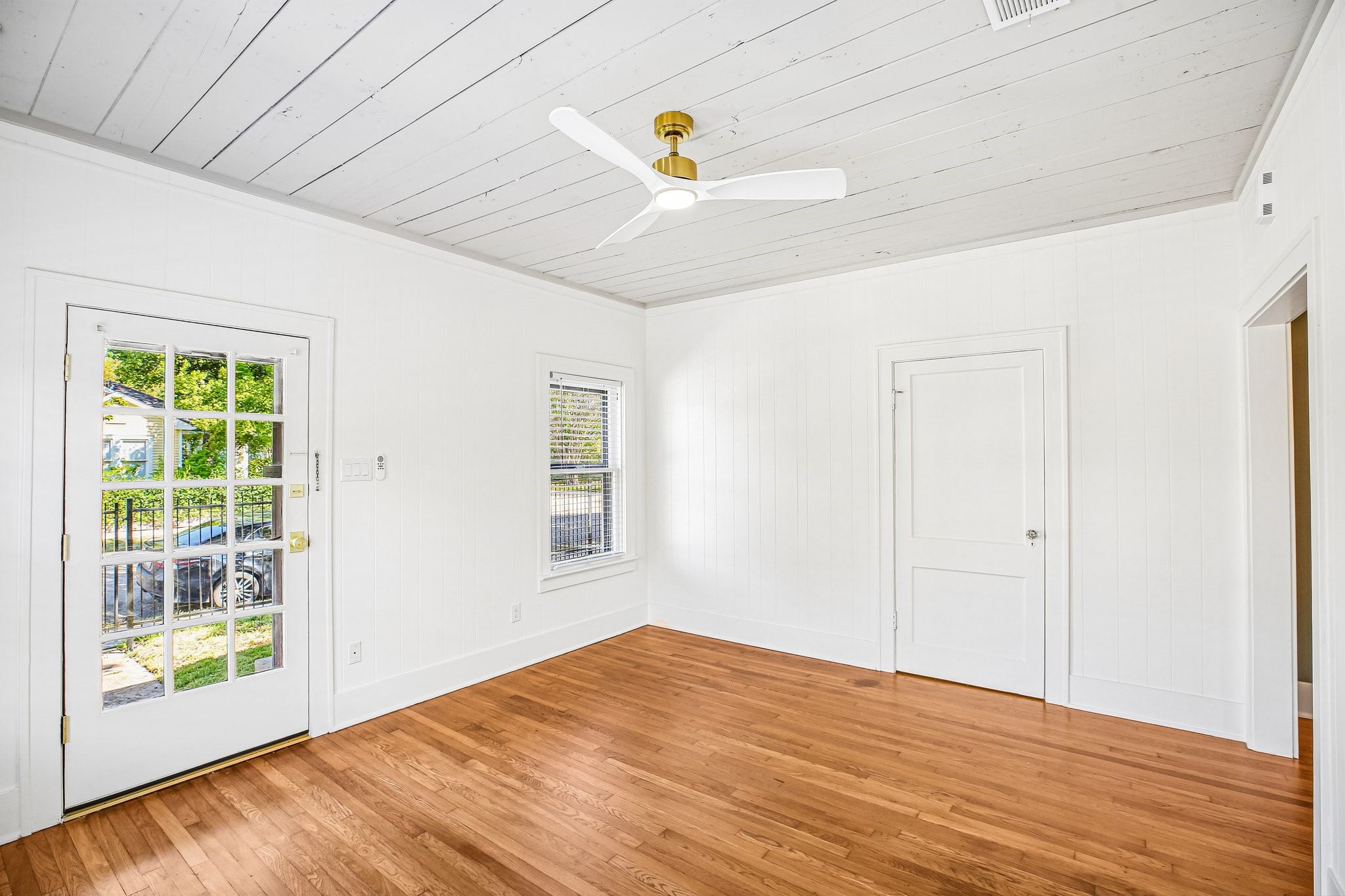 The front door also has a storm door on the outside with a lock to provide extra security and light. The modern fan blends in well with the ceilings and has a dimmable light.