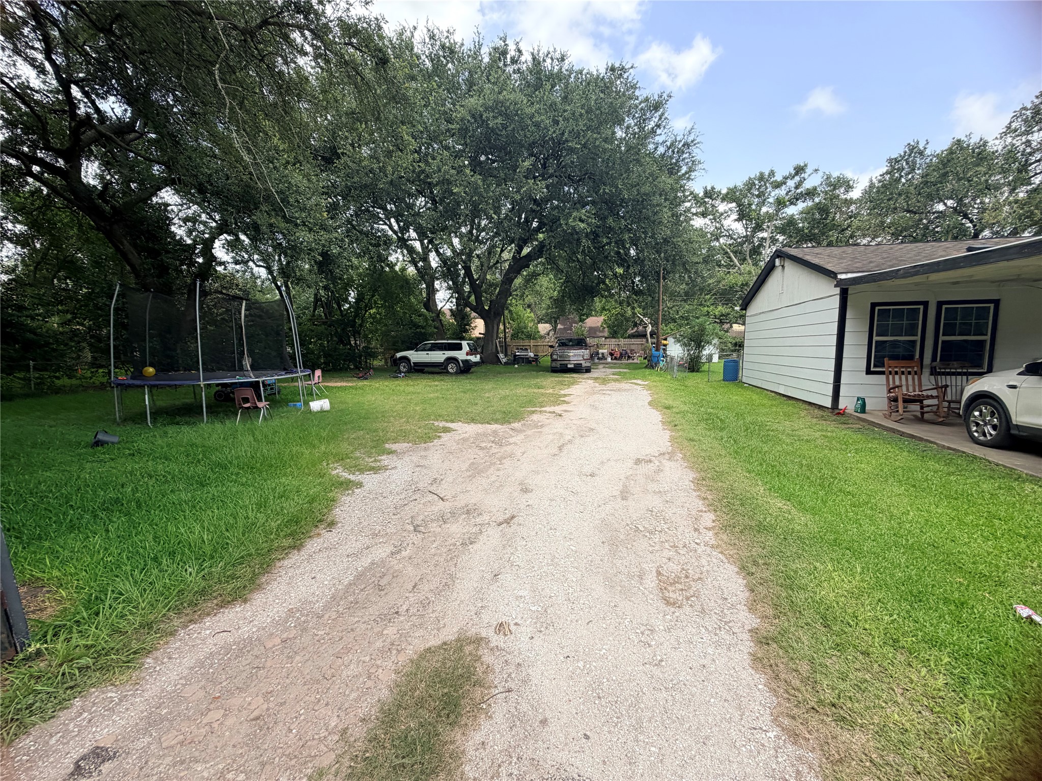 Looking into the property from the driveway, this homesite is ready for your vision with public water and sewer available.
