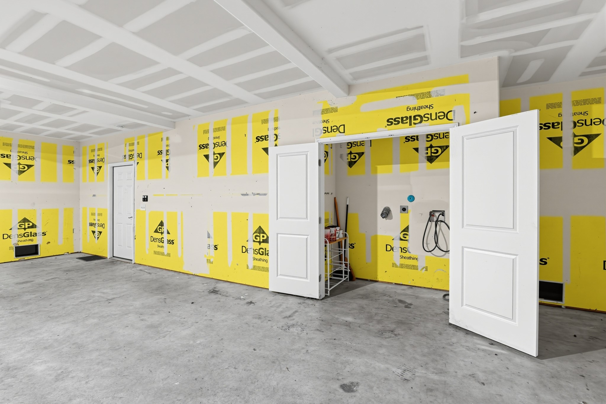Garage with washer and dryer hookups.