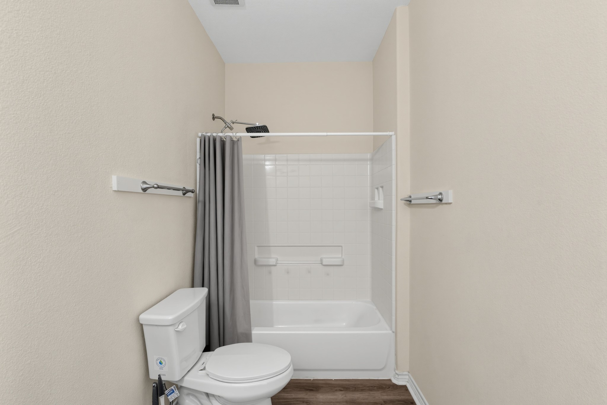 A bathroom featuring a bathtub and a tiled shower enclosure.