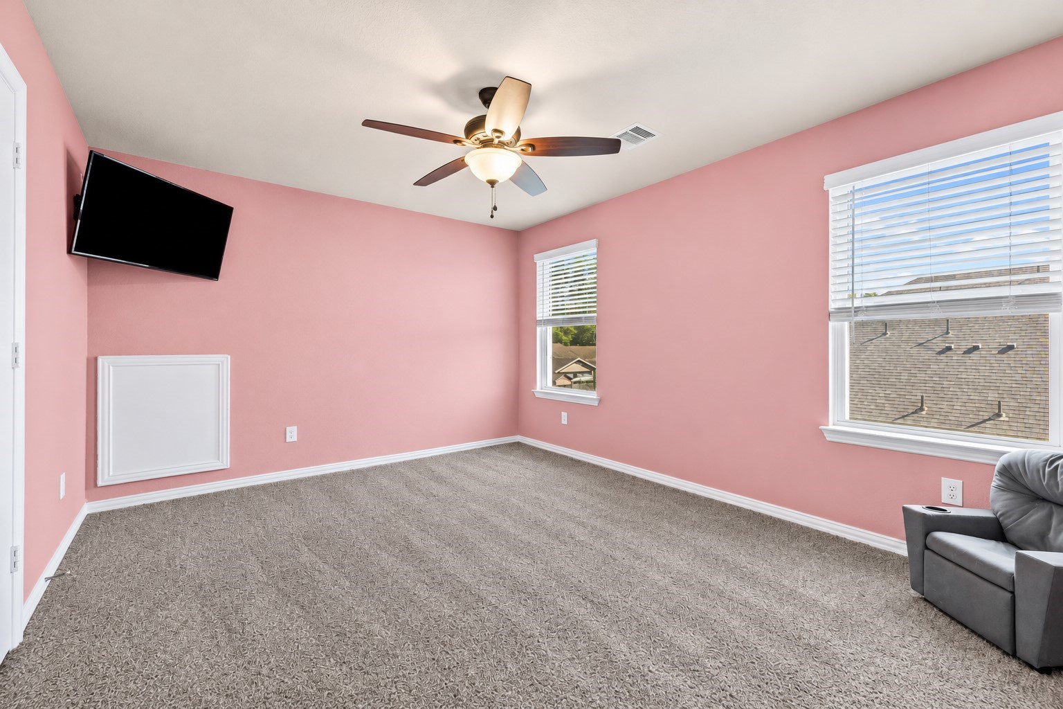 Spacious upstairs bedroom with abundant natural light and room to make it your own!