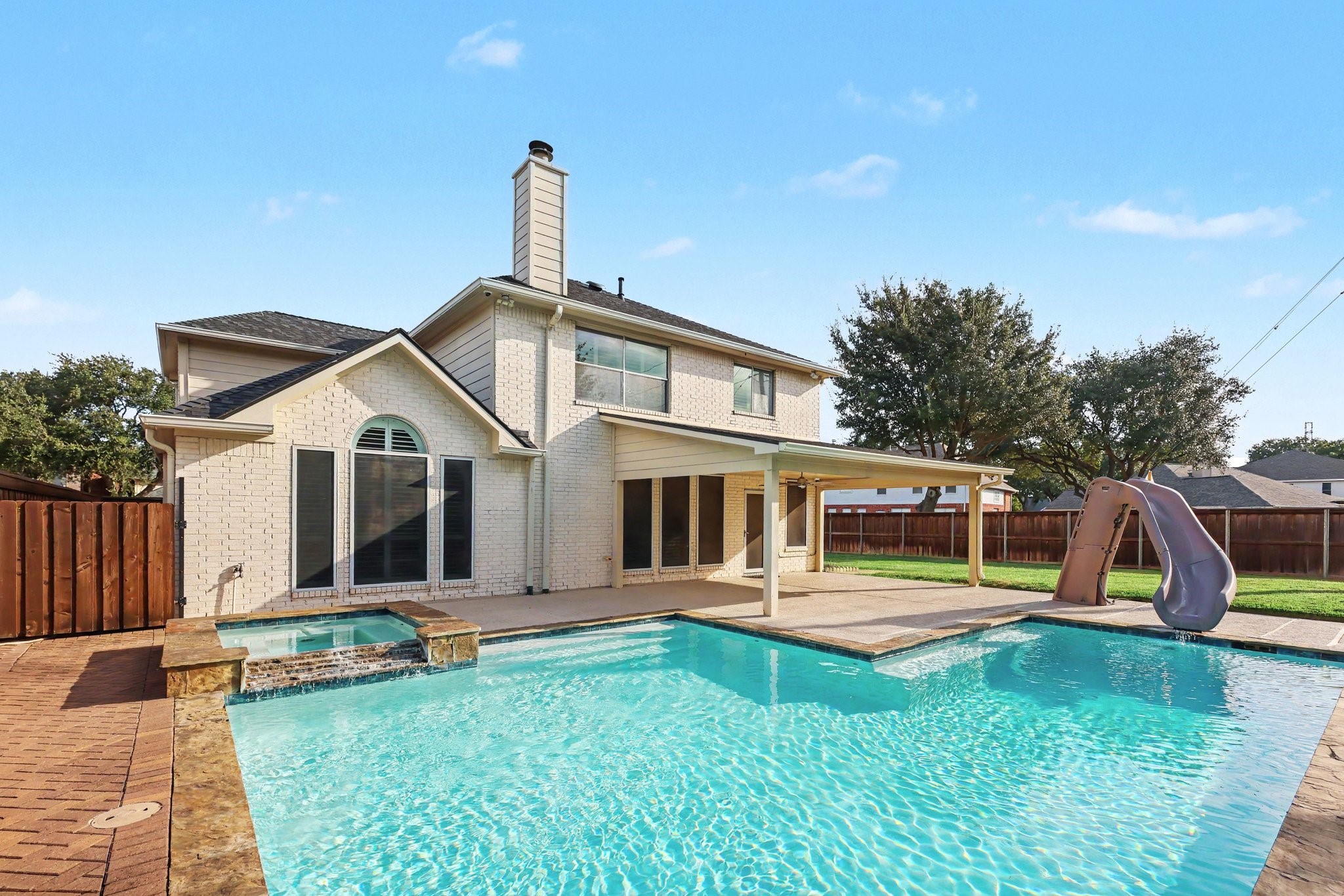 Covered patio perfect for grilling and outdoor gatherings.